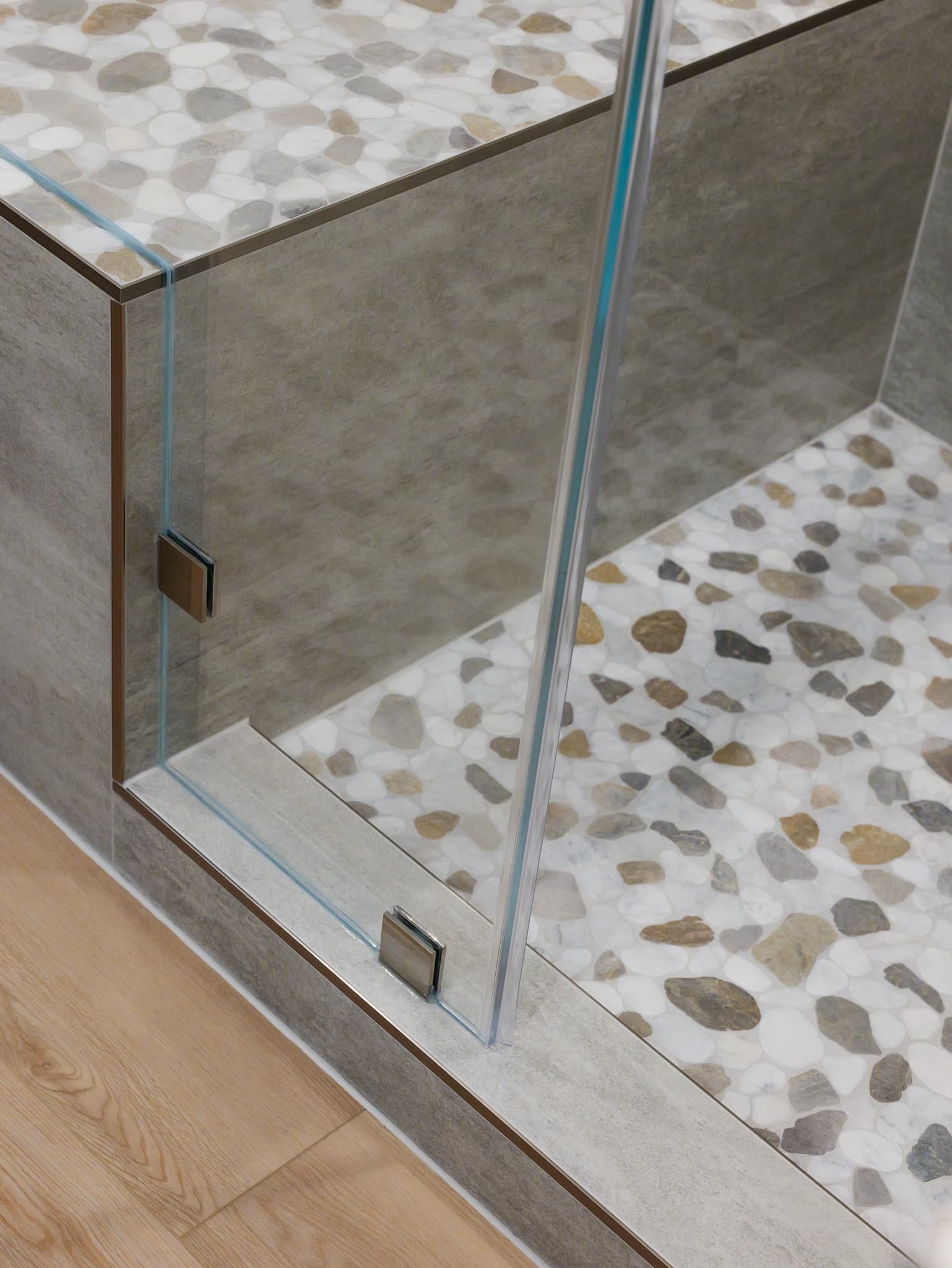 Bathroom Remodel in Roseville — frameless glass shower, walk-in shower, natural-stone tile flooring, tiled shower surround, hardwood flooring