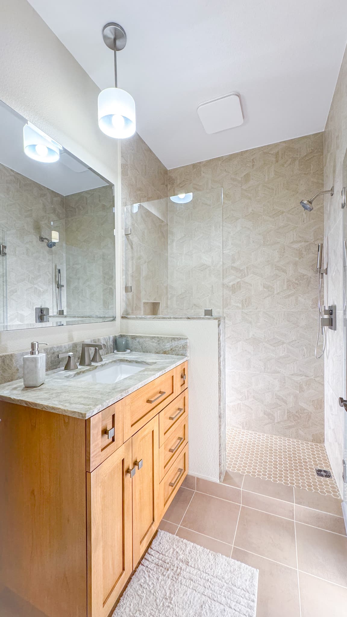 Bathroom Remodel in Sacramento — single vanity, undermount sink, frameless glass shower, tiled shower surround, handheld shower