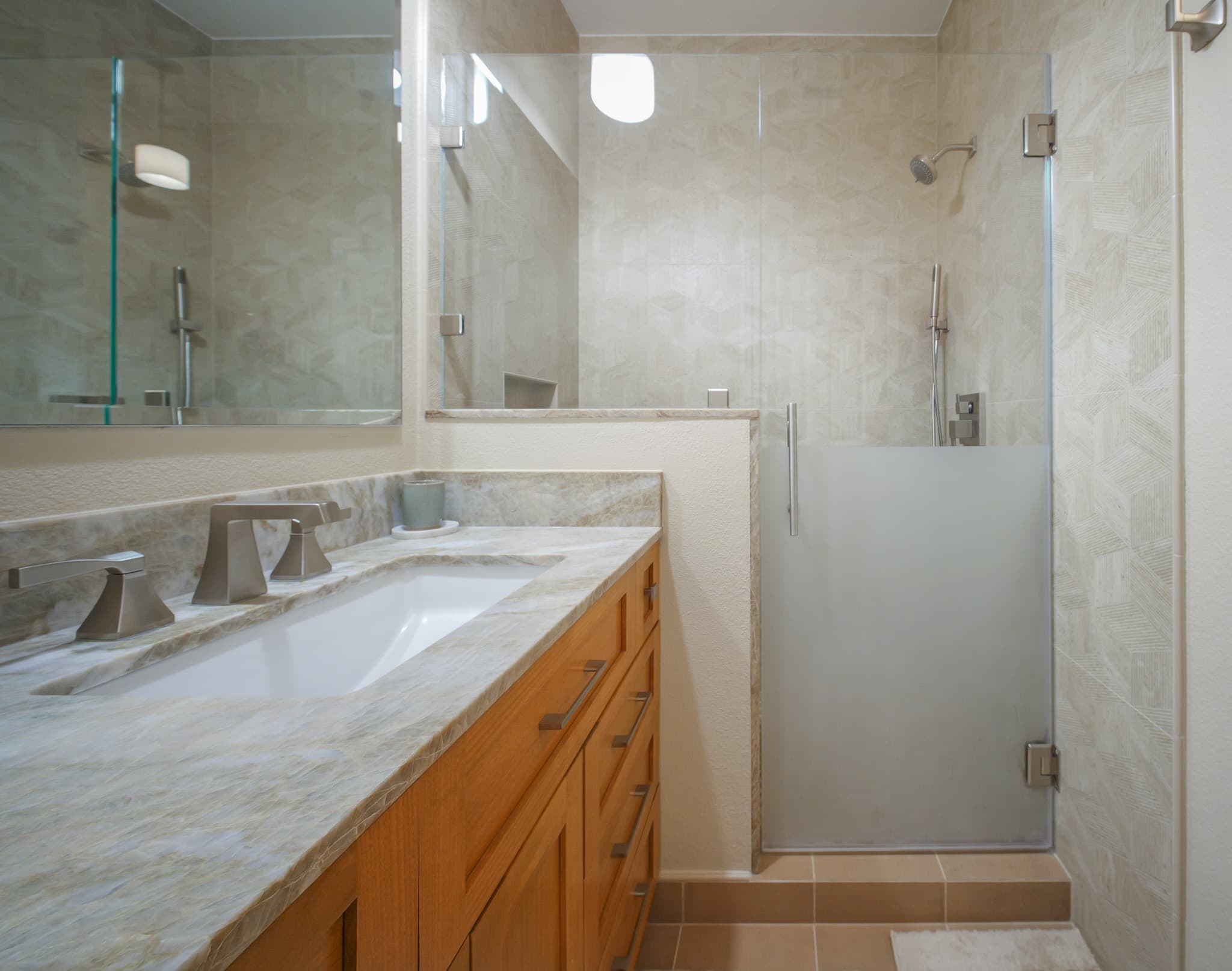 Bathroom Remodel in Sacramento — walk-in shower, frameless glass shower, tiled shower surround, undermount sink, marble countertop
