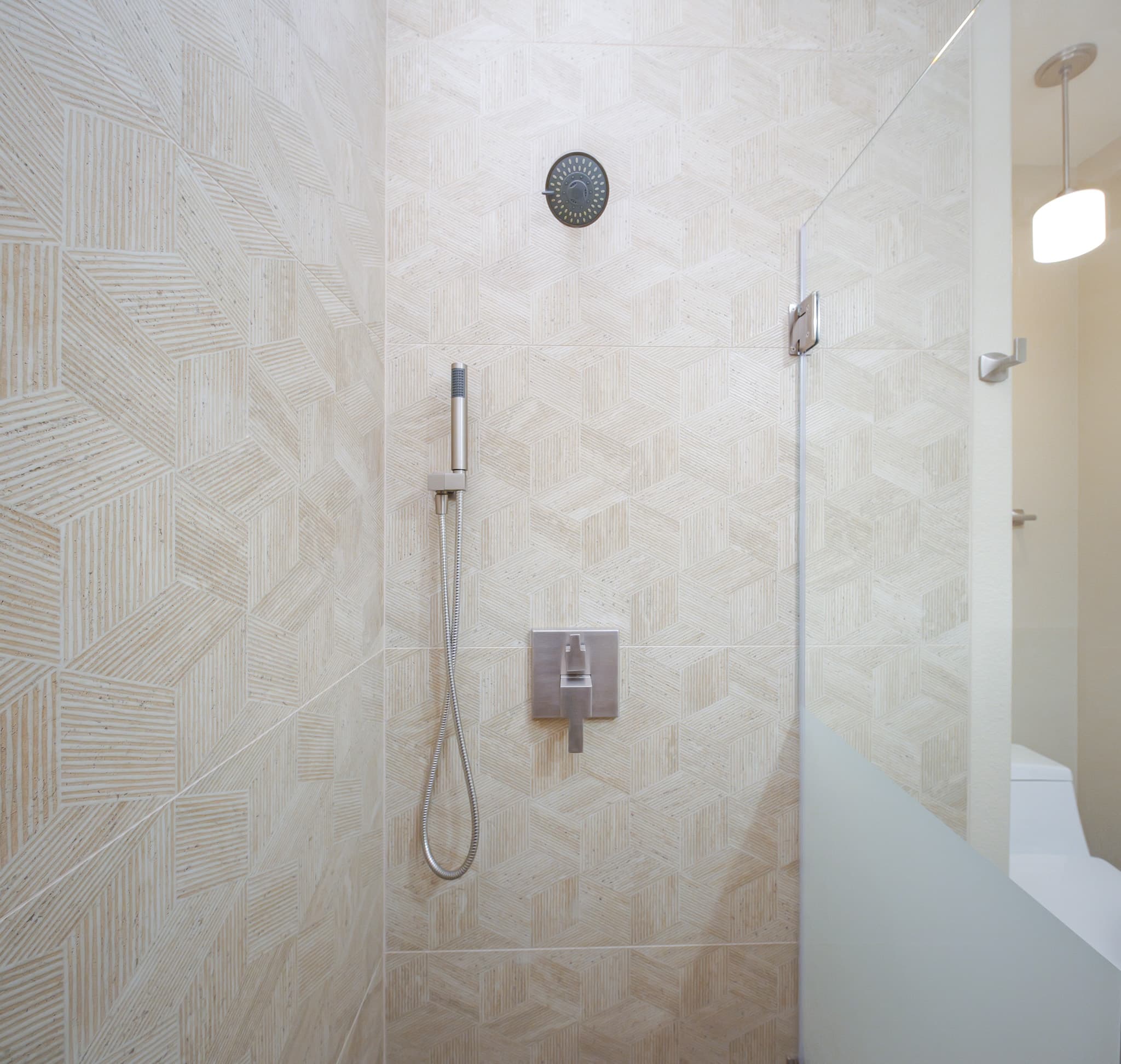 Bathroom Remodel in Sacramento — walk-in shower, frameless glass shower, tiled shower surround, rain shower head, handheld shower