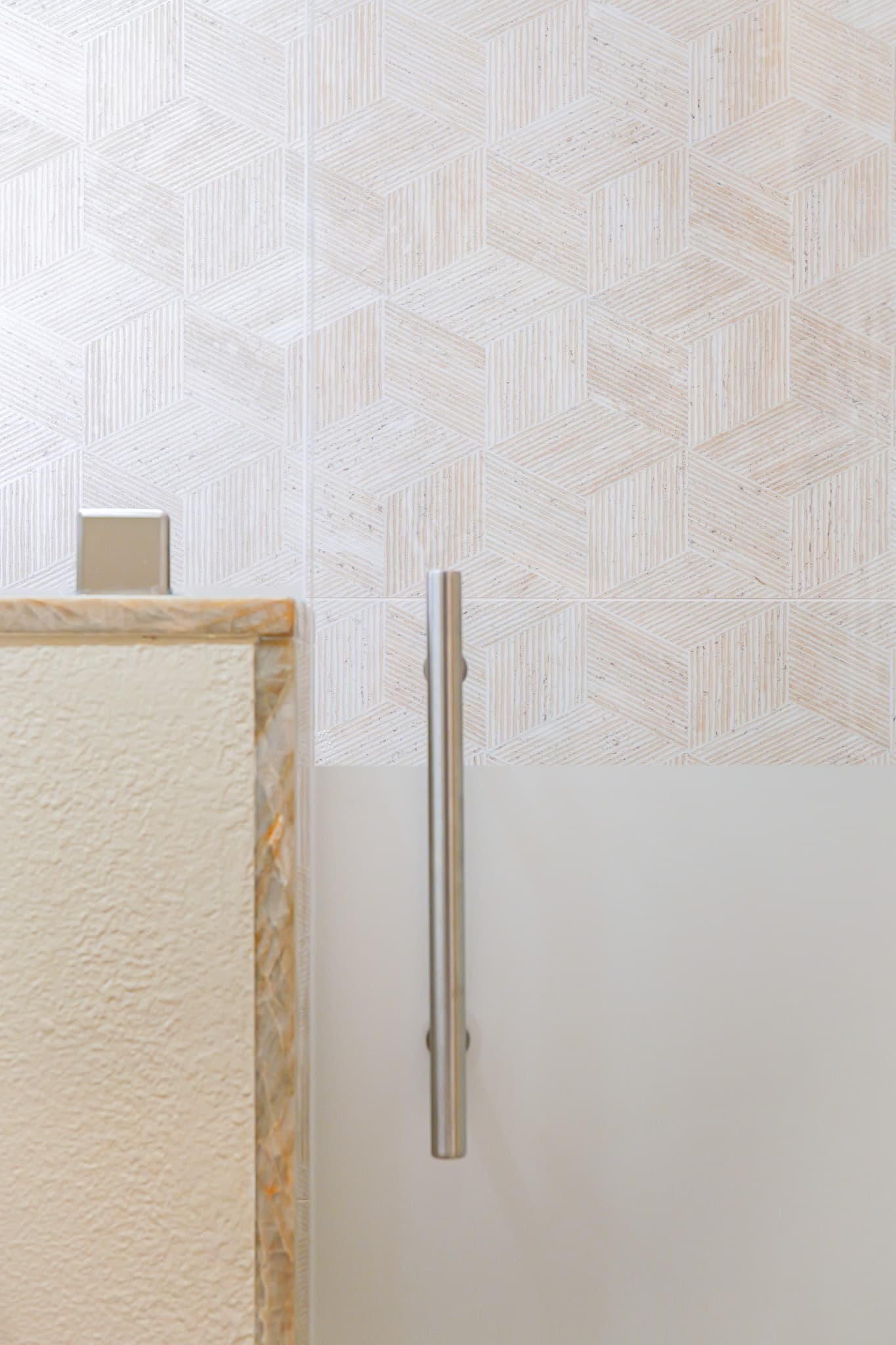 Bathroom Remodel in Sacramento — frameless glass shower, tiled shower surround, walk-in shower, mosaic backsplash, natural-stone tile flooring