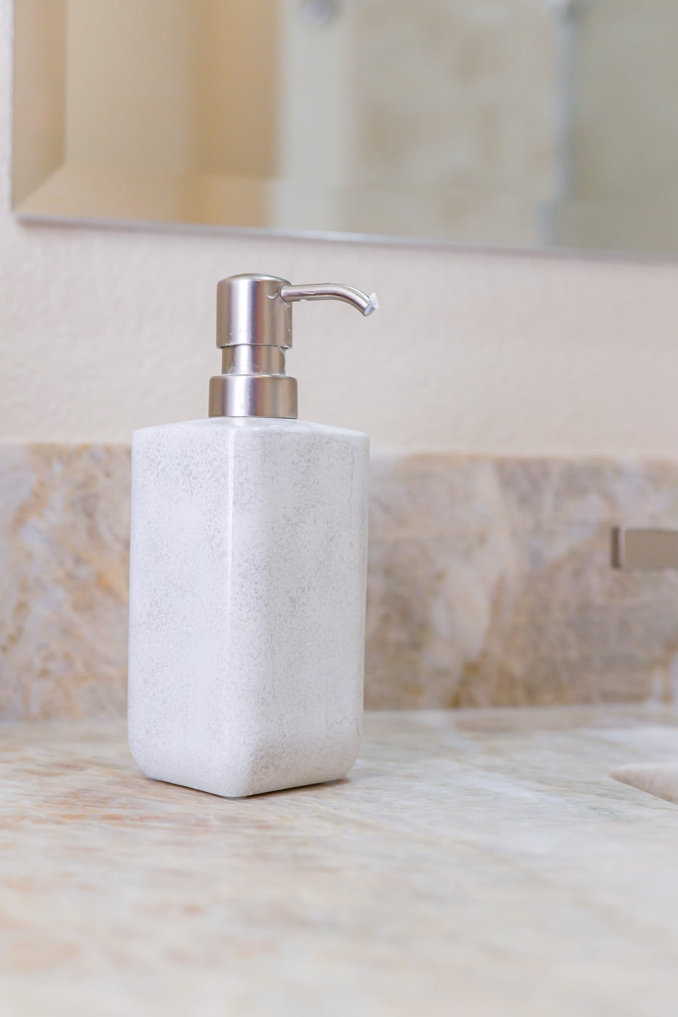 Bathroom Remodel in Sacramento — natural-stone backsplash, marble countertop, framed mirror, single vanity
