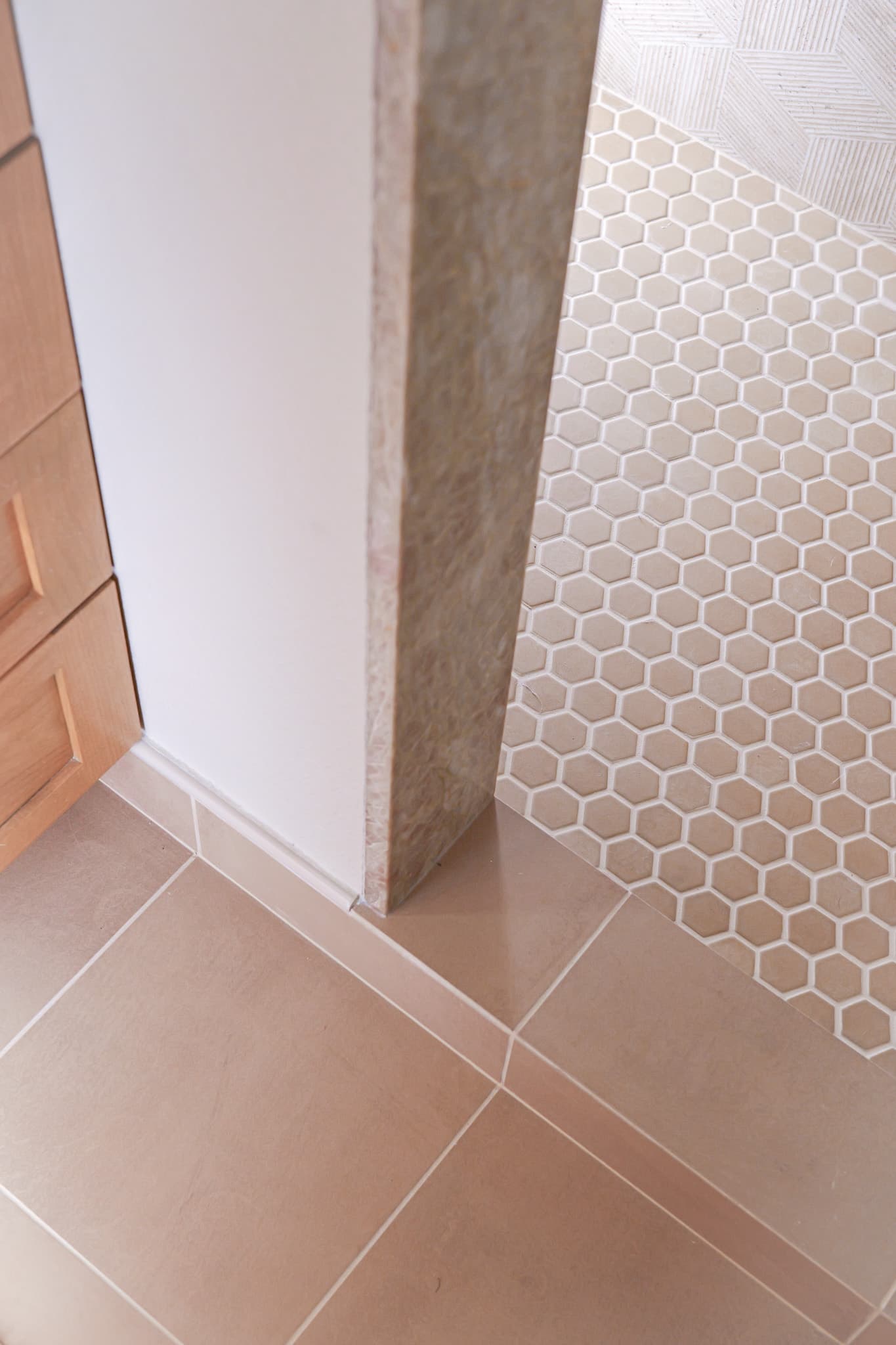 Bathroom Remodel in Sacramento — mosaic backsplash, porcelain tile flooring, walk-in shower, tiled shower surround, raised-panel cabinets