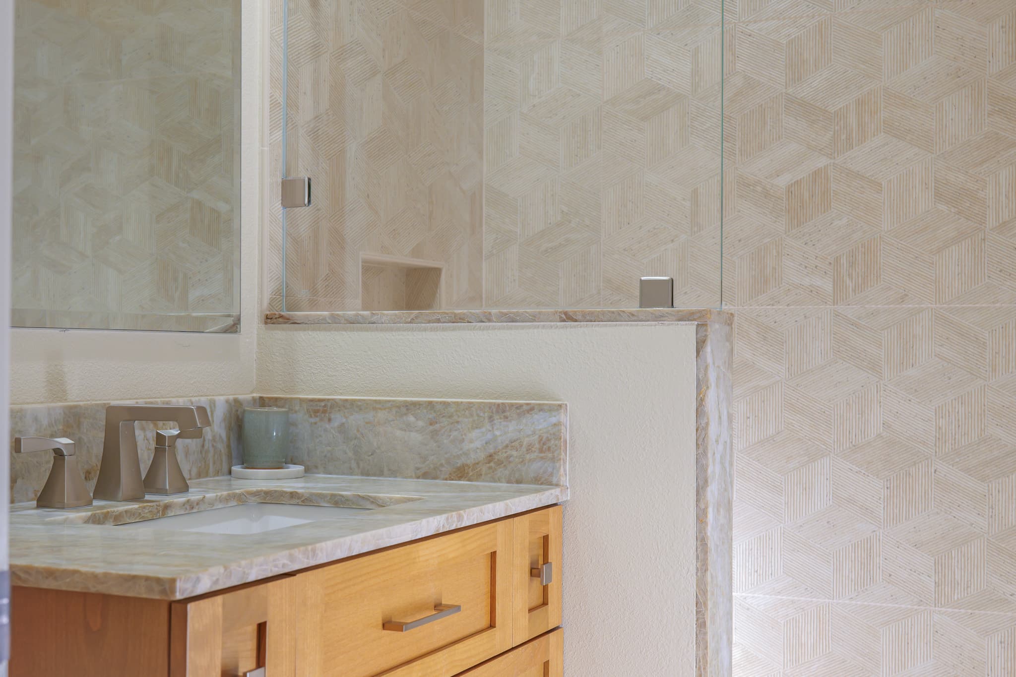 Bathroom Remodel in Sacramento — single vanity, marble countertop, frameless glass shower, tiled shower surround, undermount sink