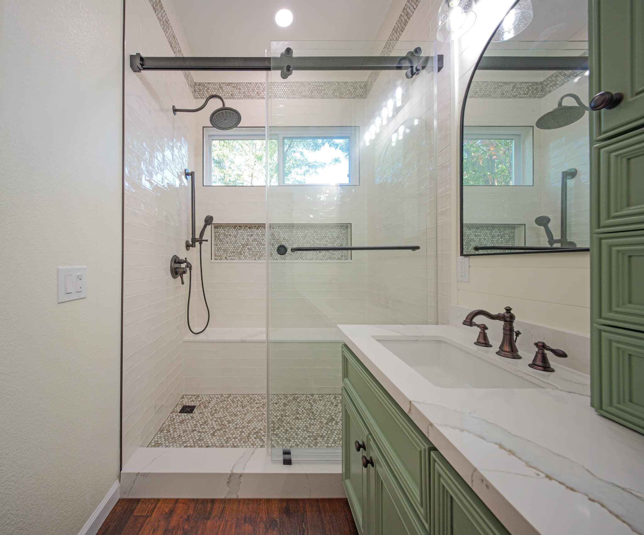 Bathroom Remodel in Sacramento — frameless glass shower, tiled shower surround, rain shower head, handheld shower, single vanity