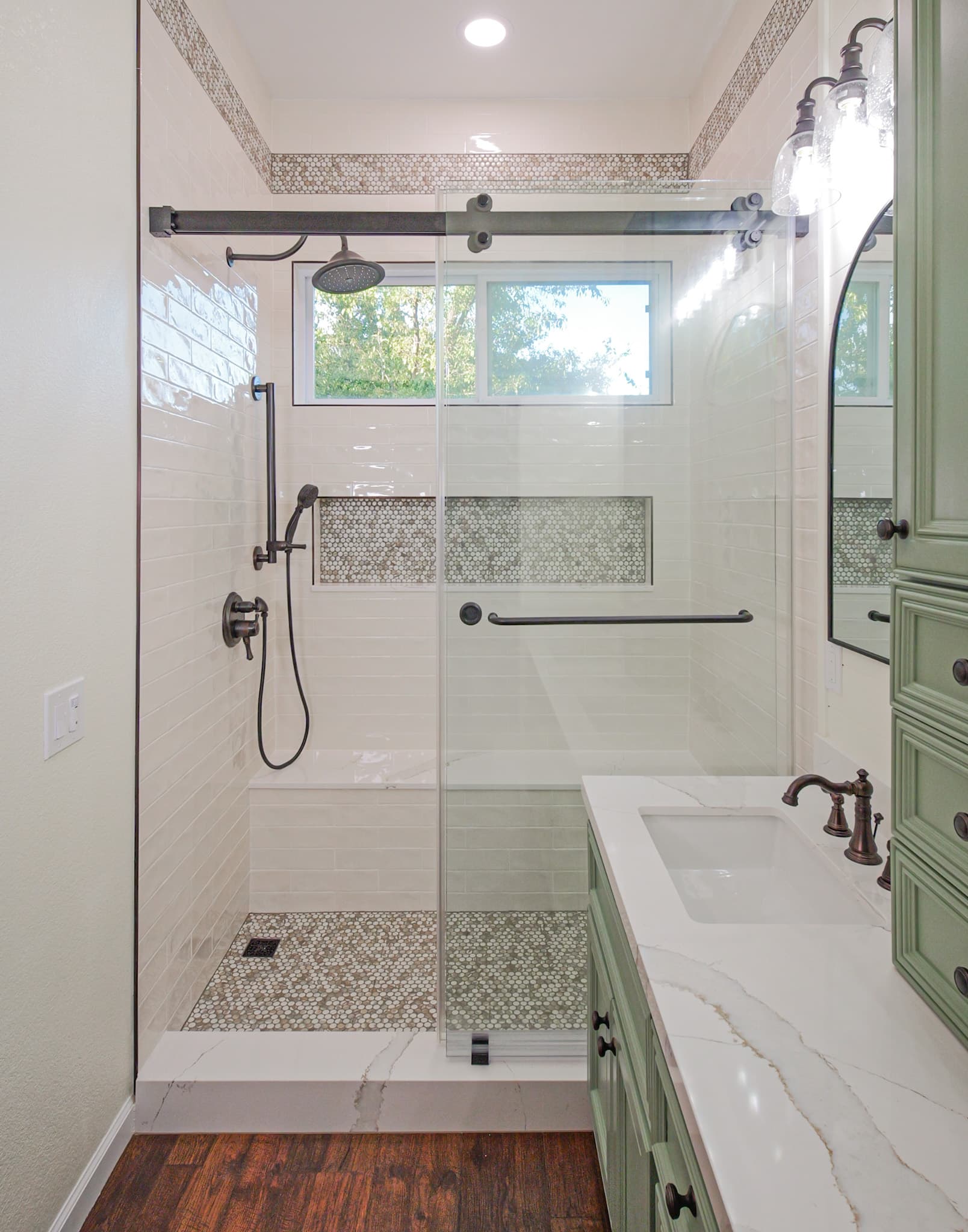 Bathroom Remodel in Sacramento — walk-in shower, frameless glass shower, tiled shower surround, rain shower head, handheld shower