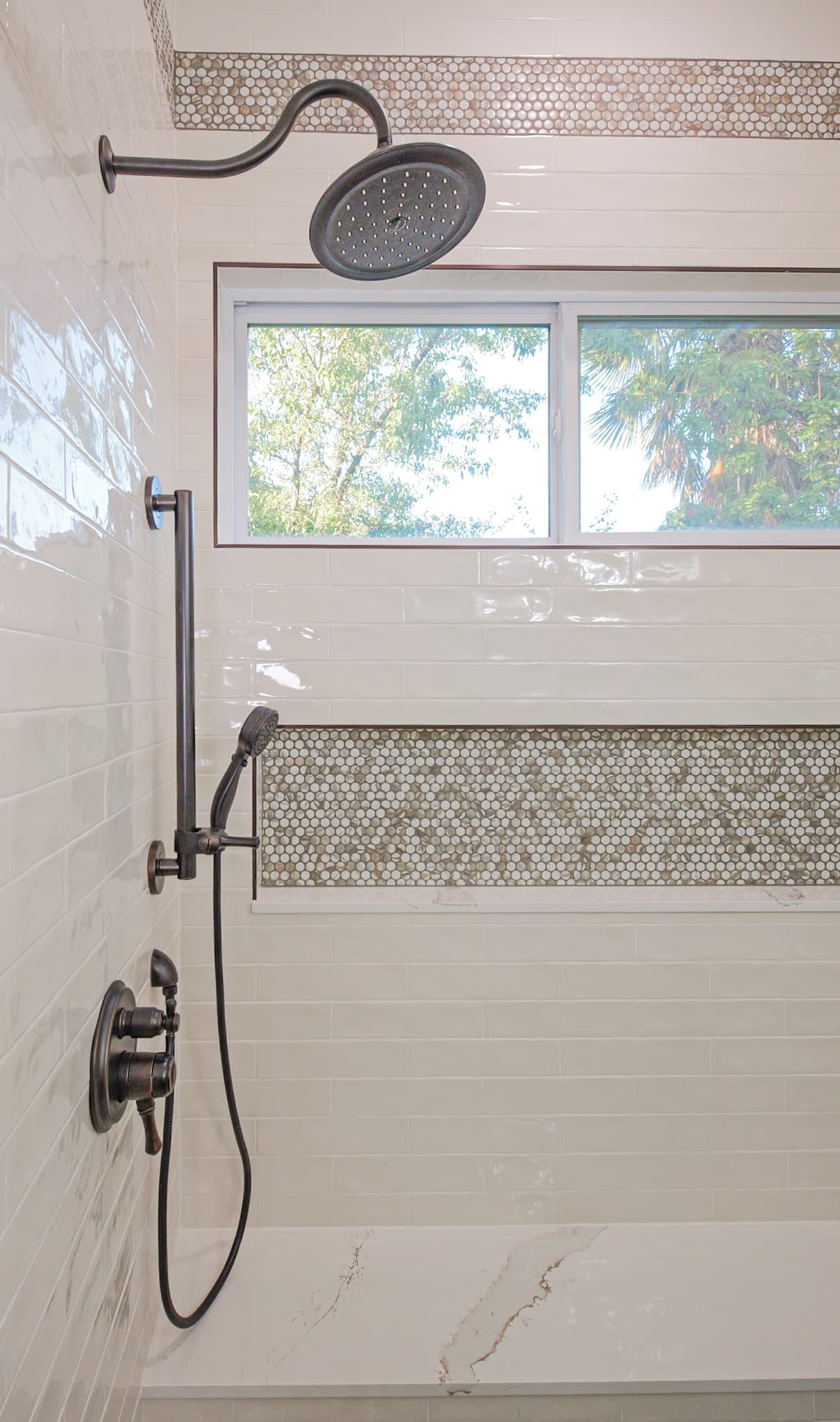 Bathroom Remodel in Sacramento — walk-in shower, tiled shower surround, rain shower head, handheld shower, mosaic backsplash