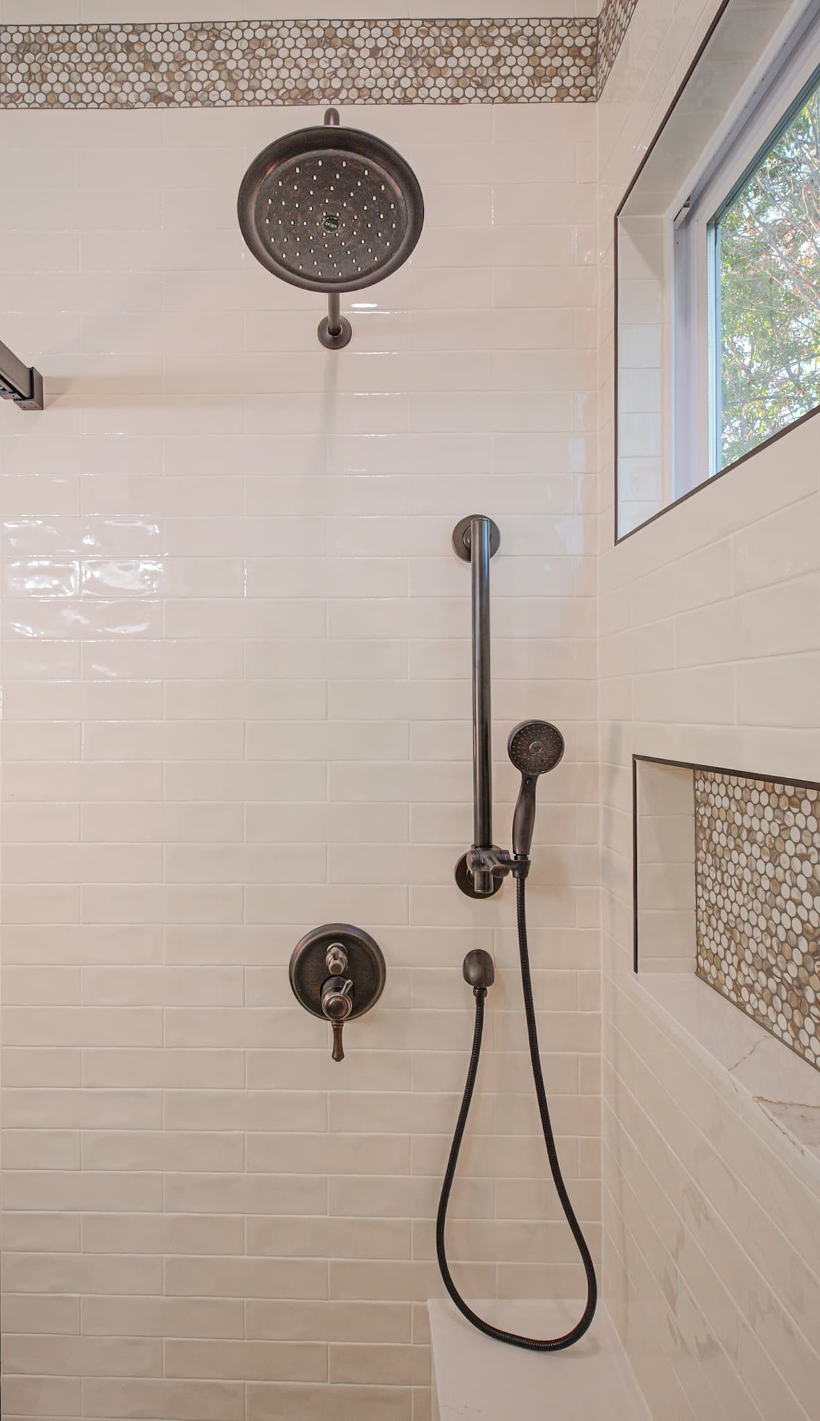 Bathroom Remodel in Sacramento — tiled shower surround, rain shower head, handheld shower, mosaic backsplash, walk-in shower