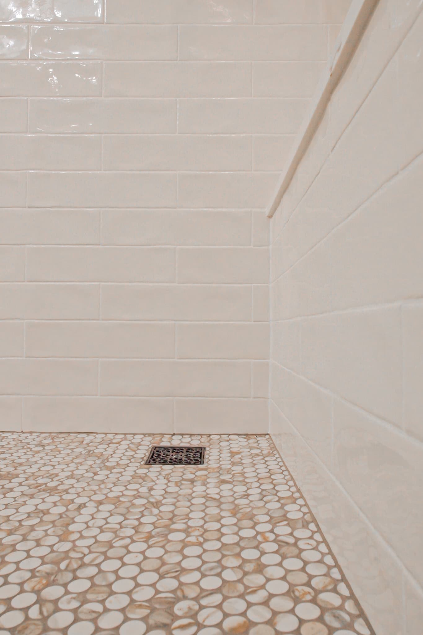 Bathroom Remodel in Sacramento — walk-in shower, tiled shower surround, subway tile backsplash, mosaic backsplash, natural-stone tile flooring
