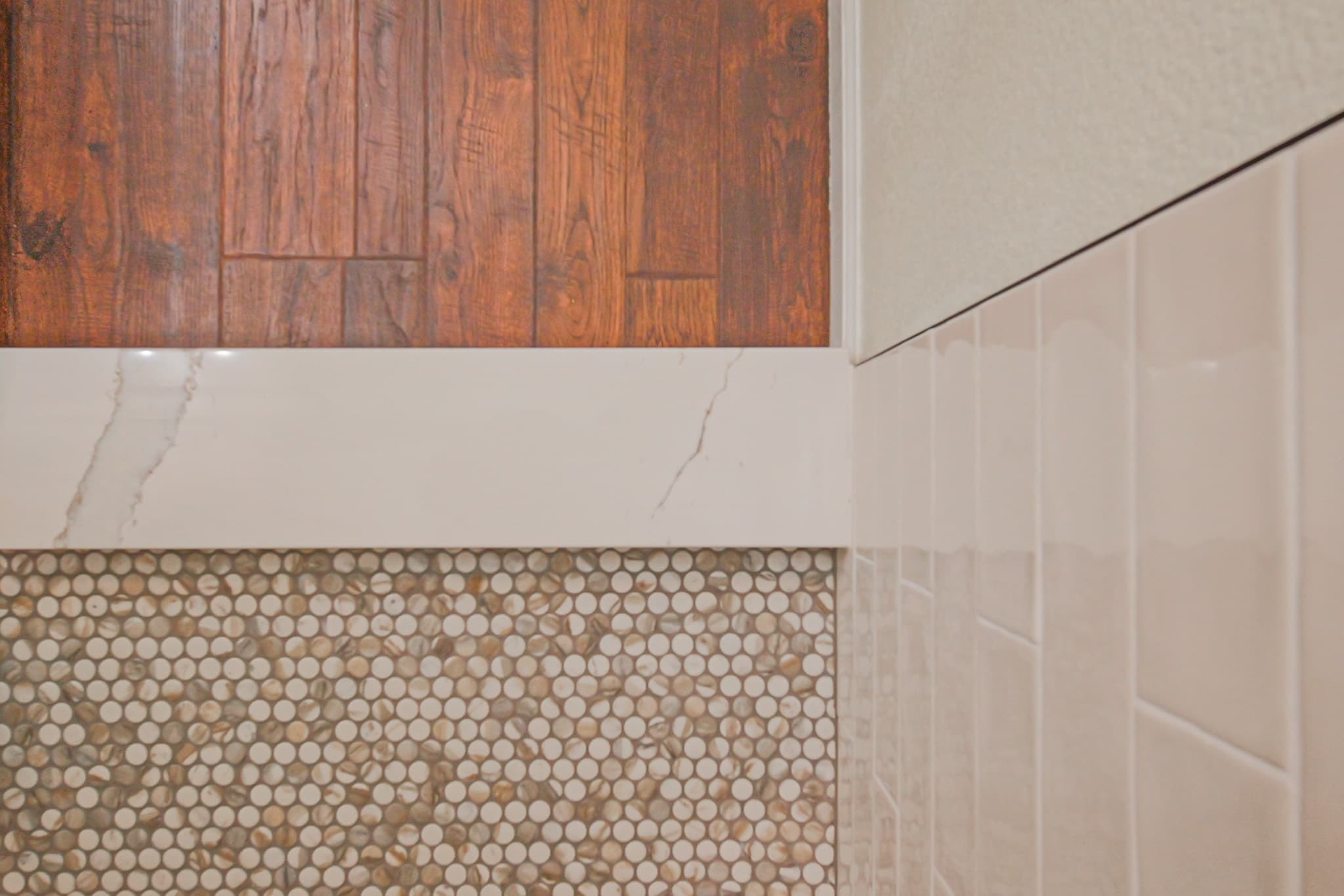 Bathroom Remodel in Sacramento — mosaic backsplash, marble countertop, hardwood flooring, tiled shower surround, shaker cabinets