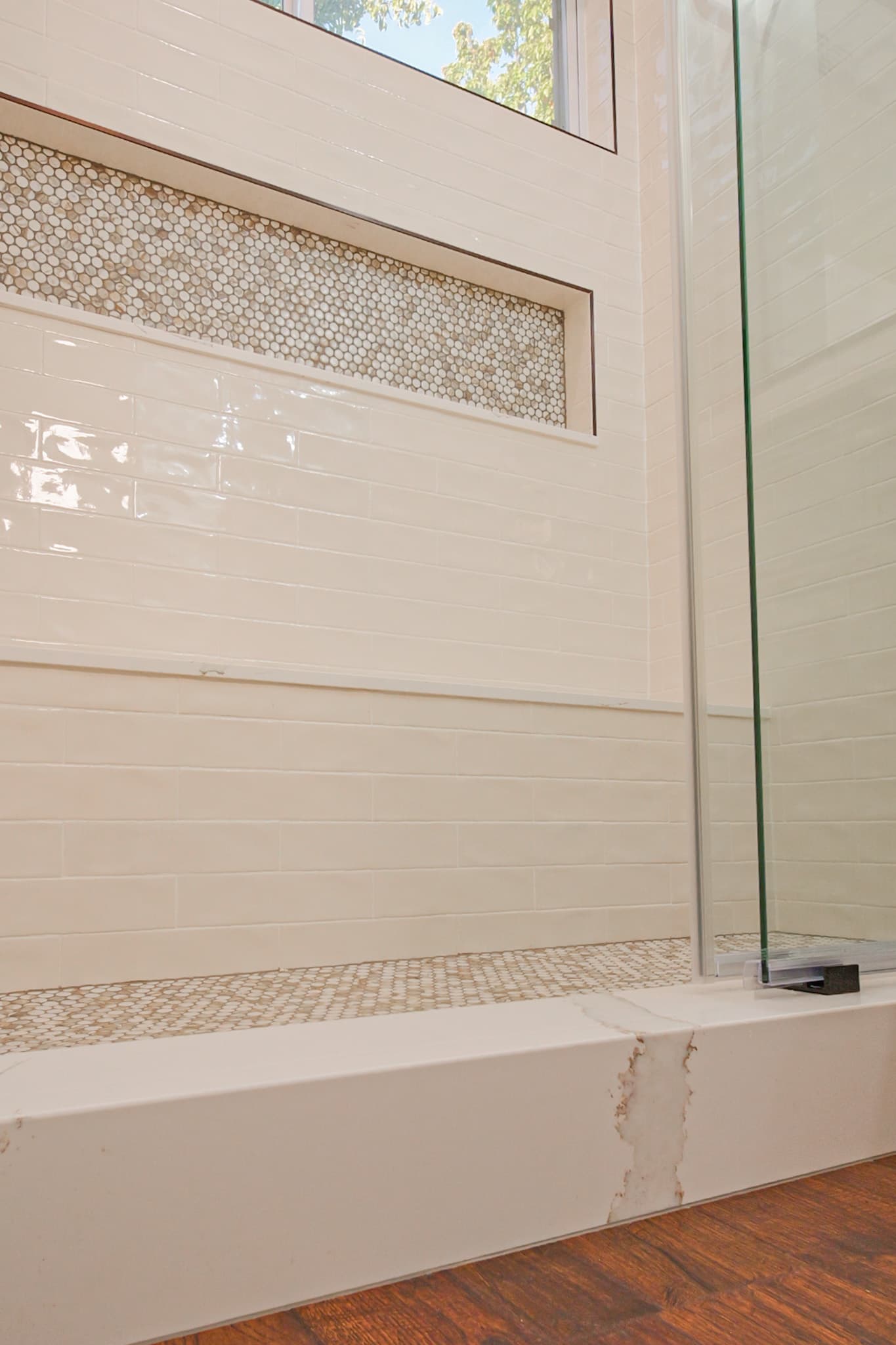 Bathroom Remodel in Sacramento — walk-in shower, frameless glass shower, tiled shower surround, shower bench, mosaic backsplash