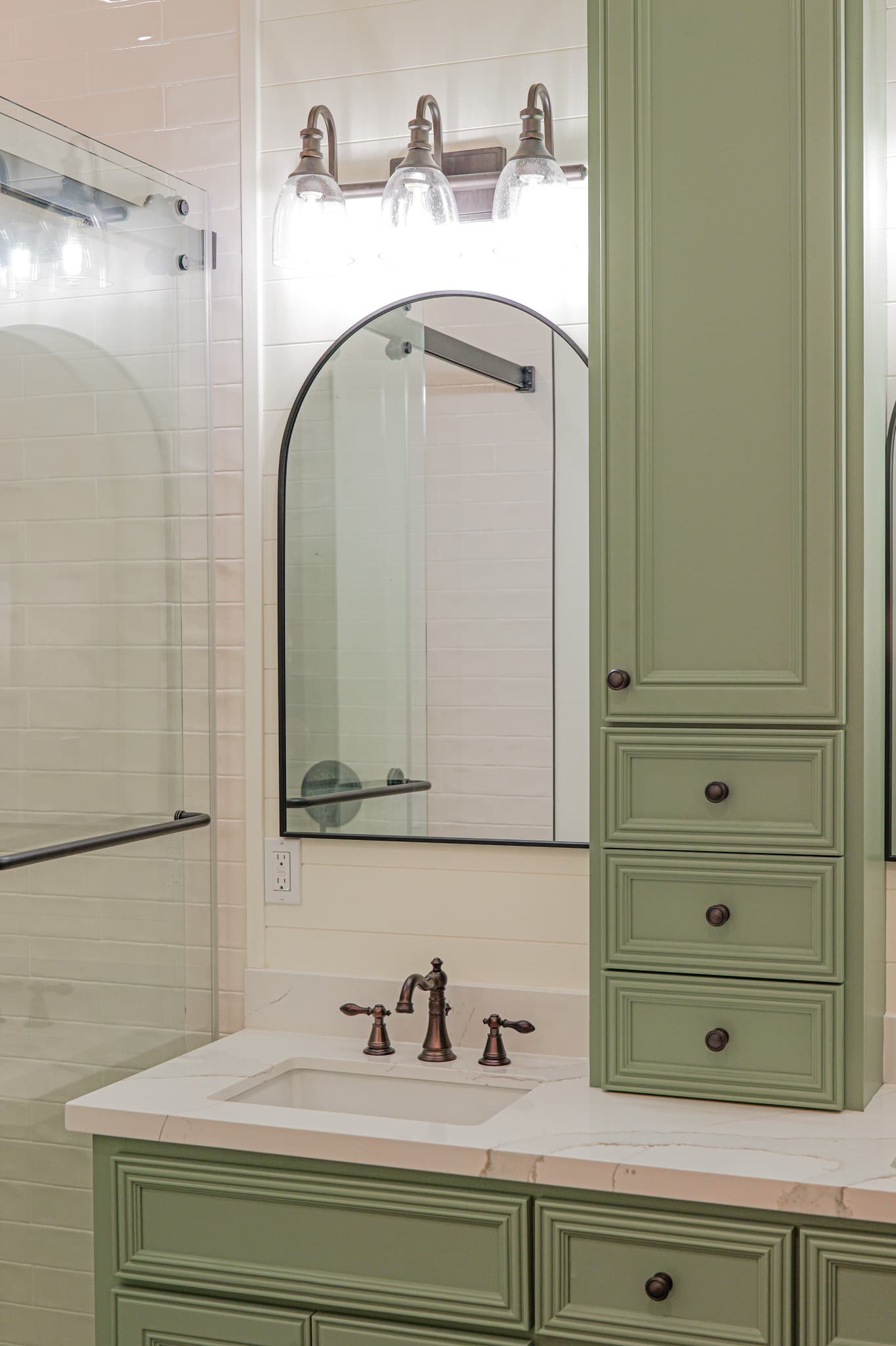 Bathroom Remodel in Sacramento — raised-panel cabinets, single vanity, undermount sink, linen tower, frameless glass shower