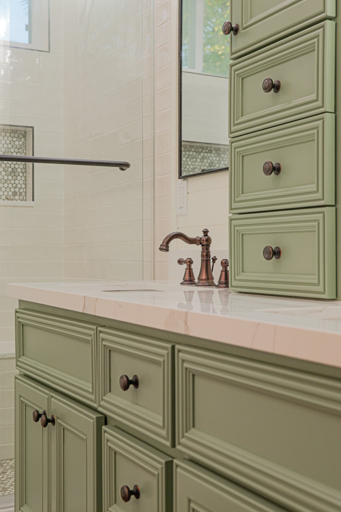 Bathroom Remodel in Sacramento — raised-panel cabinets, single vanity, linen tower, marble countertop, subway tile backsplash