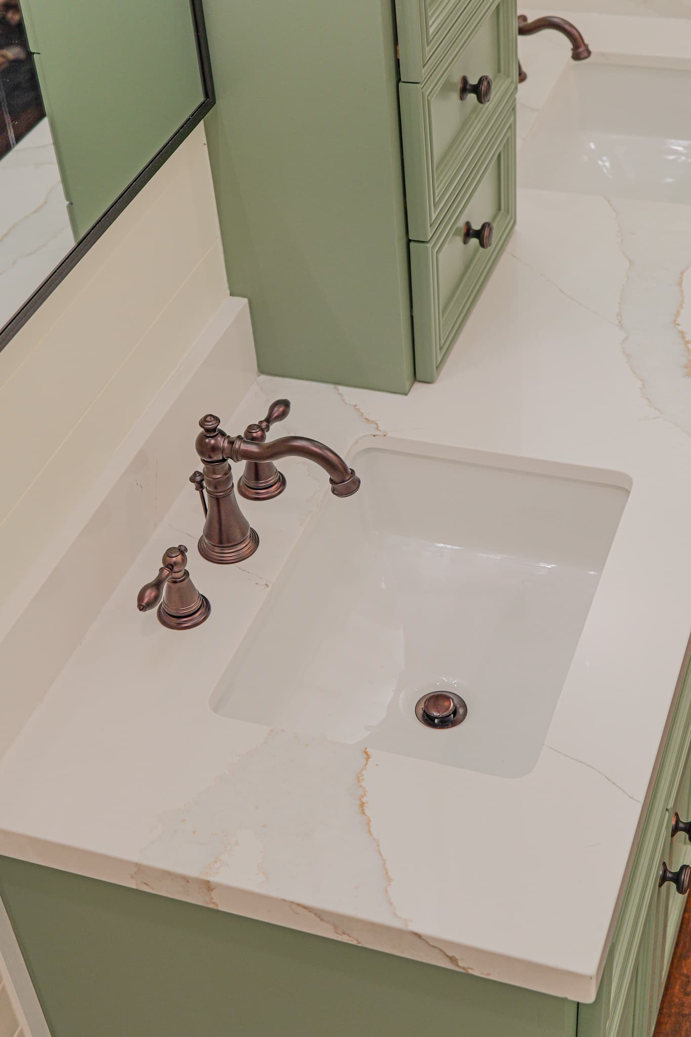 Bathroom Remodel in Sacramento — undermount sink, quartz countertop, single vanity, raised-panel cabinets, framed mirror