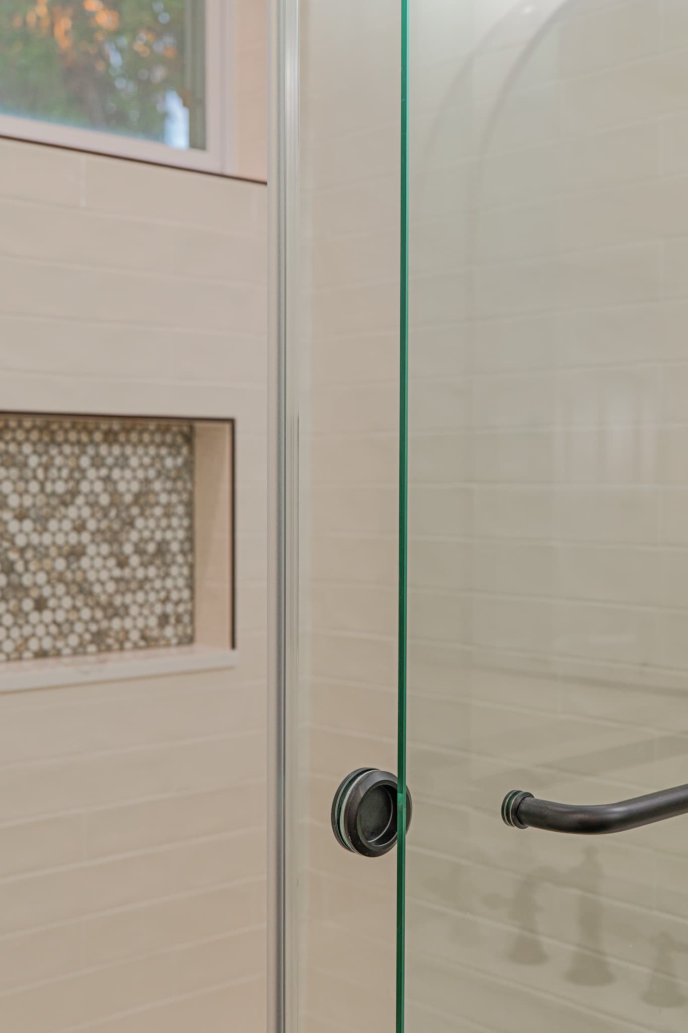 Bathroom Remodel in Sacramento — frameless glass shower, walk-in shower, tiled shower surround, mosaic backsplash