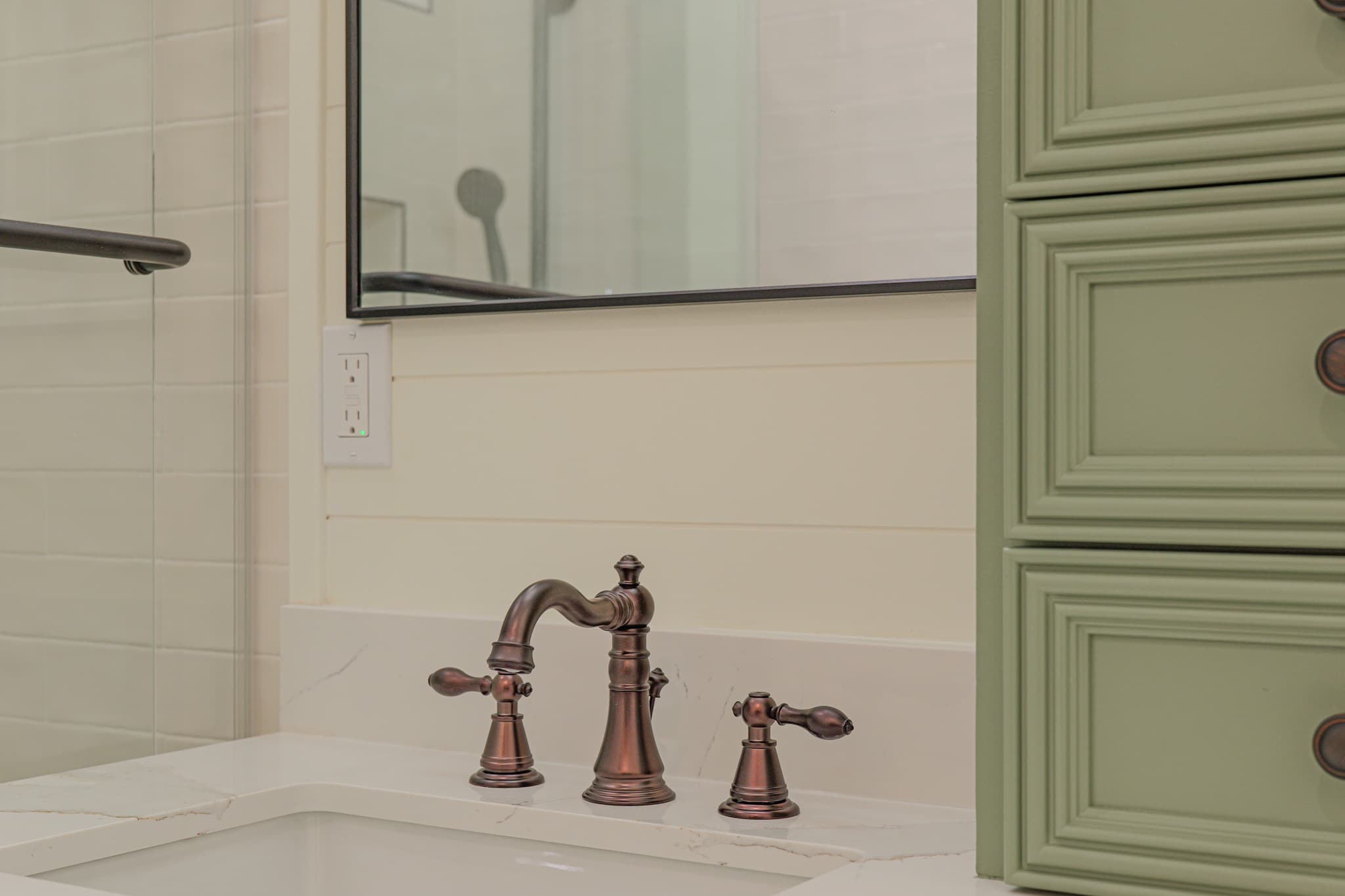 Bathroom Remodel in Sacramento — raised-panel cabinets, undermount sink, quartz countertop, framed mirror, tiled shower surround