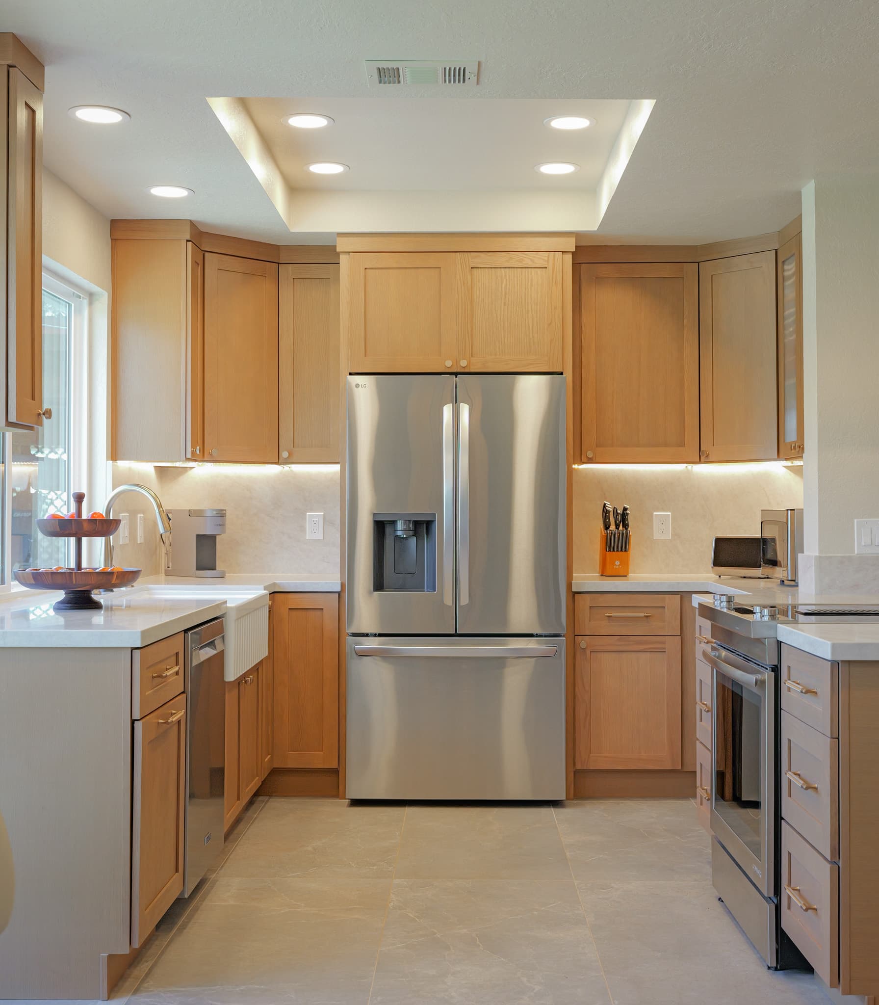 House Renovation in Sacramento — shaker cabinets, recessed lighting, under-cabinet lighting, farmhouse sink, stainless appliances