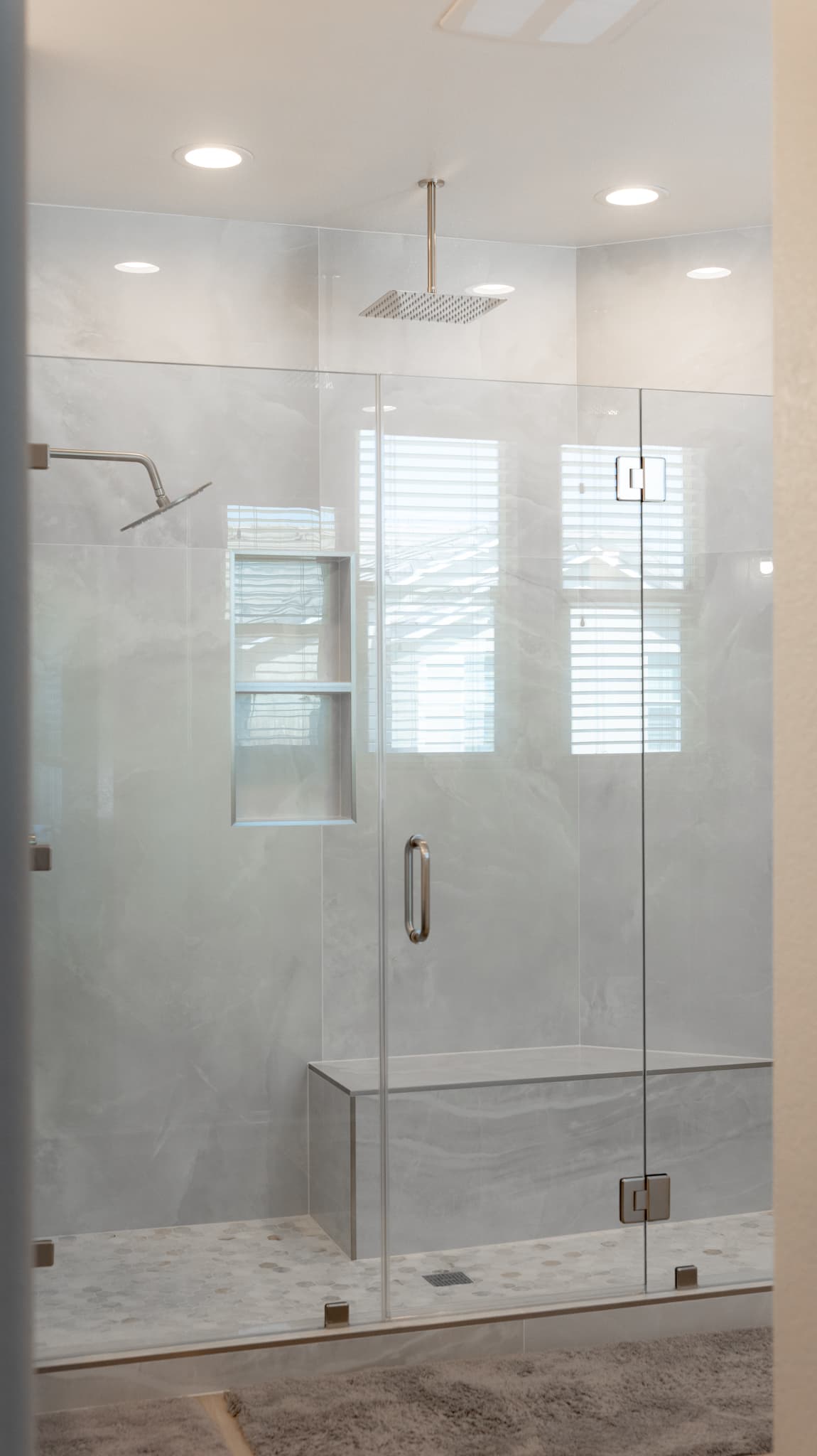Bathroom Remodel in Sacramento — frameless glass shower, walk-in shower, rain shower head, shower bench, recessed lighting