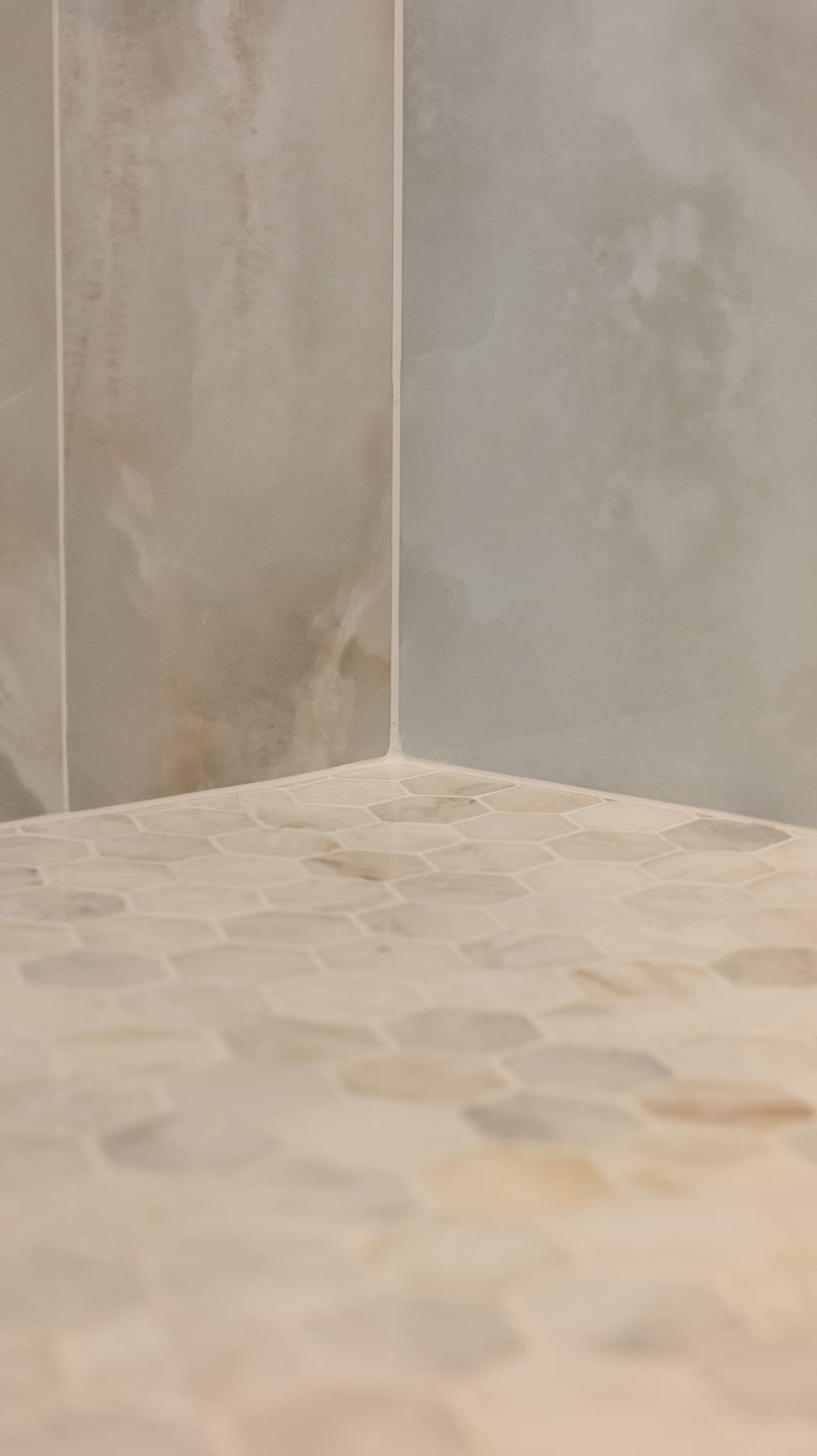 Bathroom Remodel in Sacramento — walk-in shower, tiled shower surround, mosaic backsplash, natural-stone tile flooring