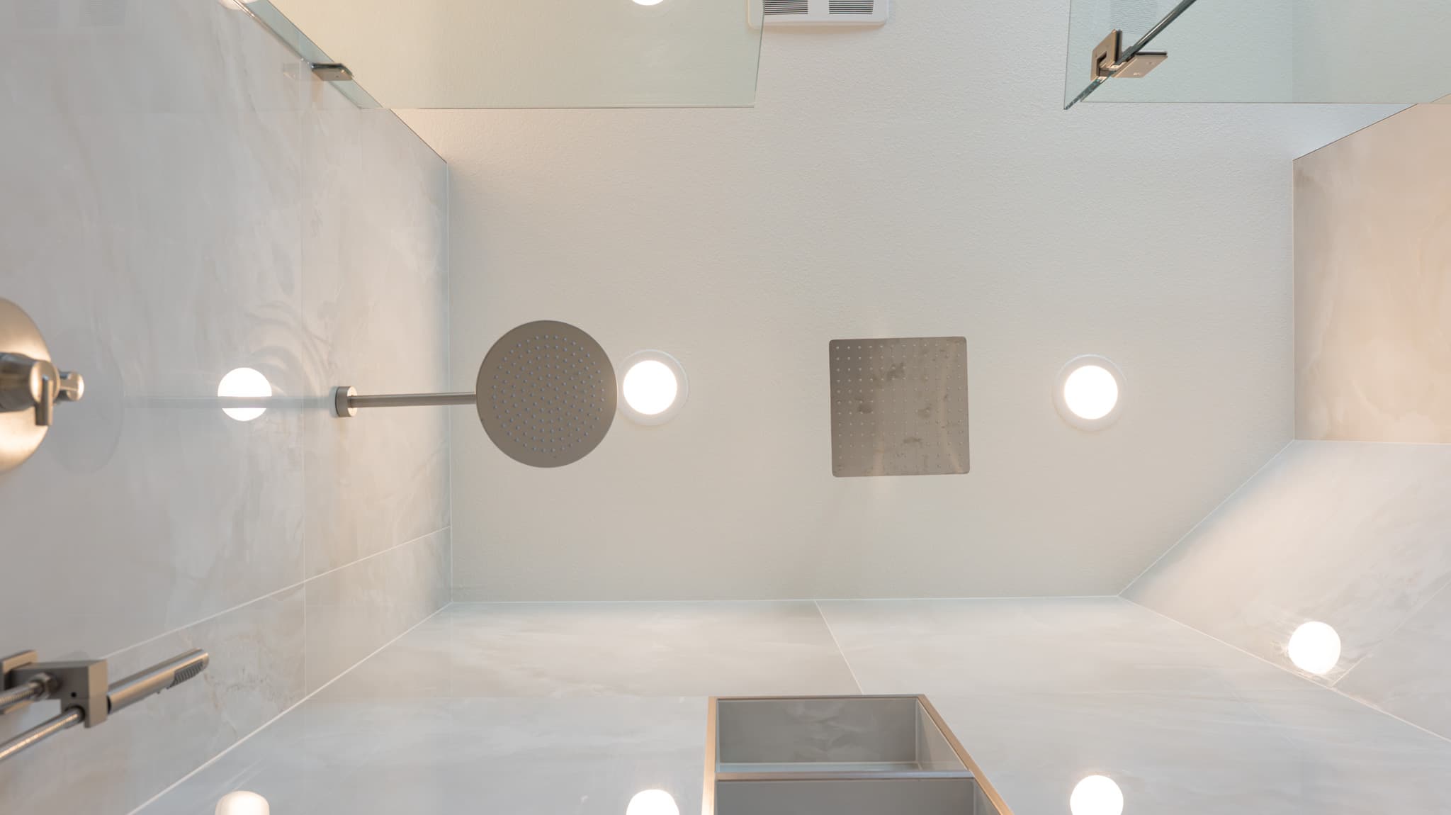 Bathroom Remodel in Sacramento — walk-in shower, frameless glass shower, rain shower head, shower bench, recessed lighting