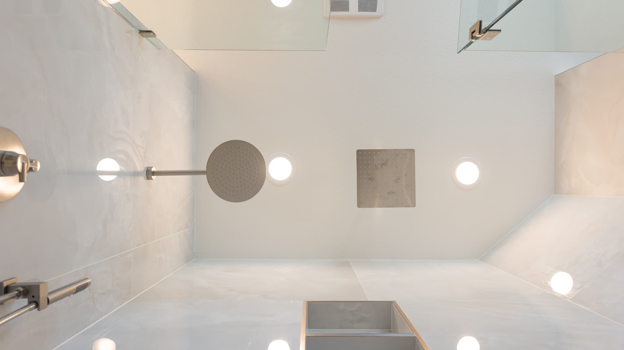 Bathroom Remodel in Sacramento — walk-in shower, frameless glass shower, rain shower head, handheld shower, recessed lighting