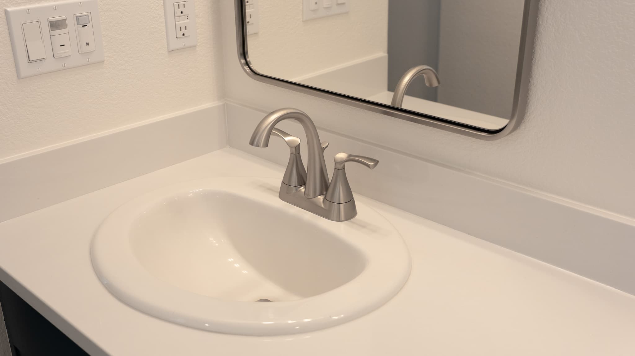 Bathroom Remodel in Sacramento — single vanity, framed mirror, quartz countertop, undermount sink