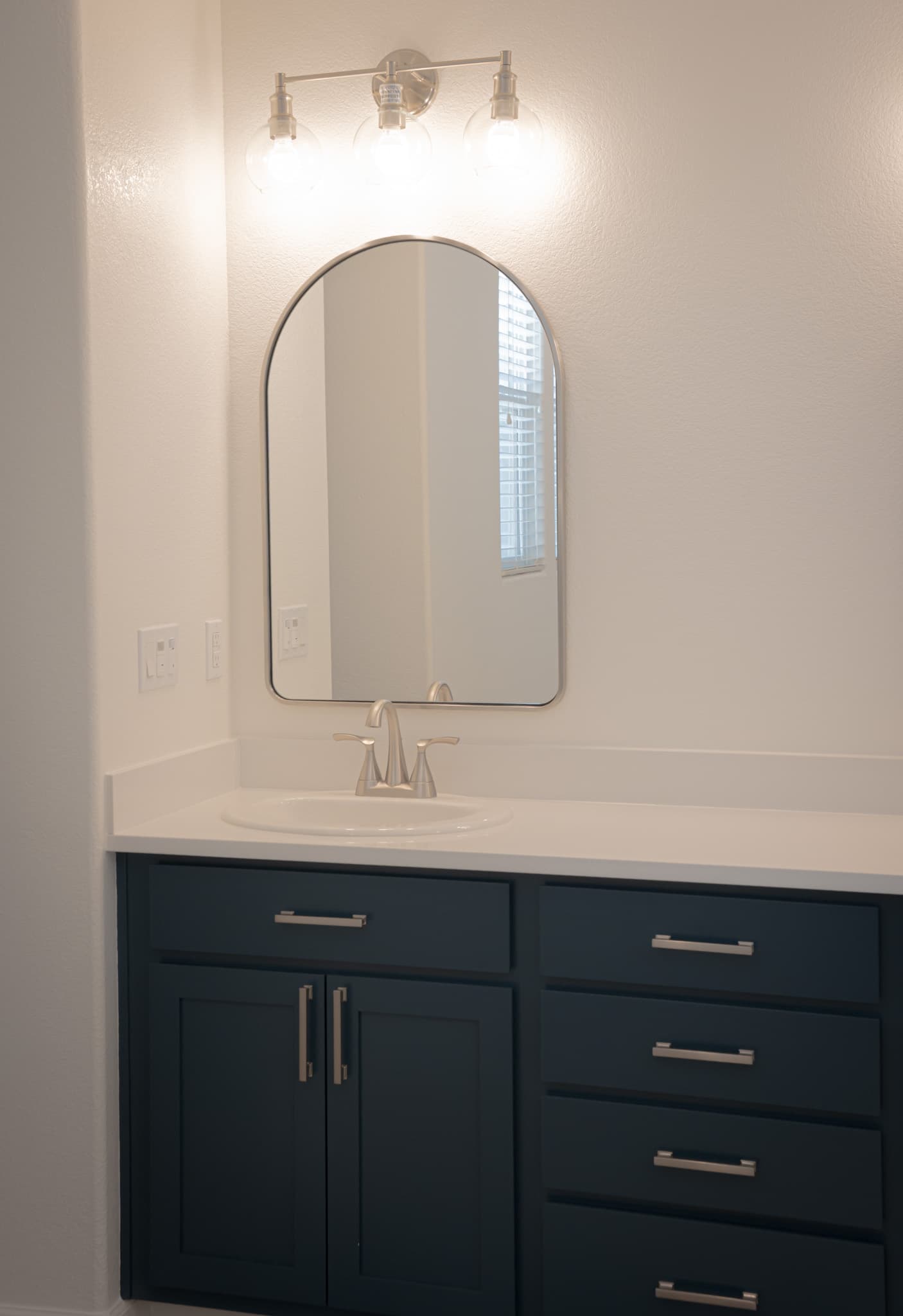 Bathroom Remodel in Sacramento — single vanity, shaker cabinets, quartz countertop, framed mirror, undermount sink