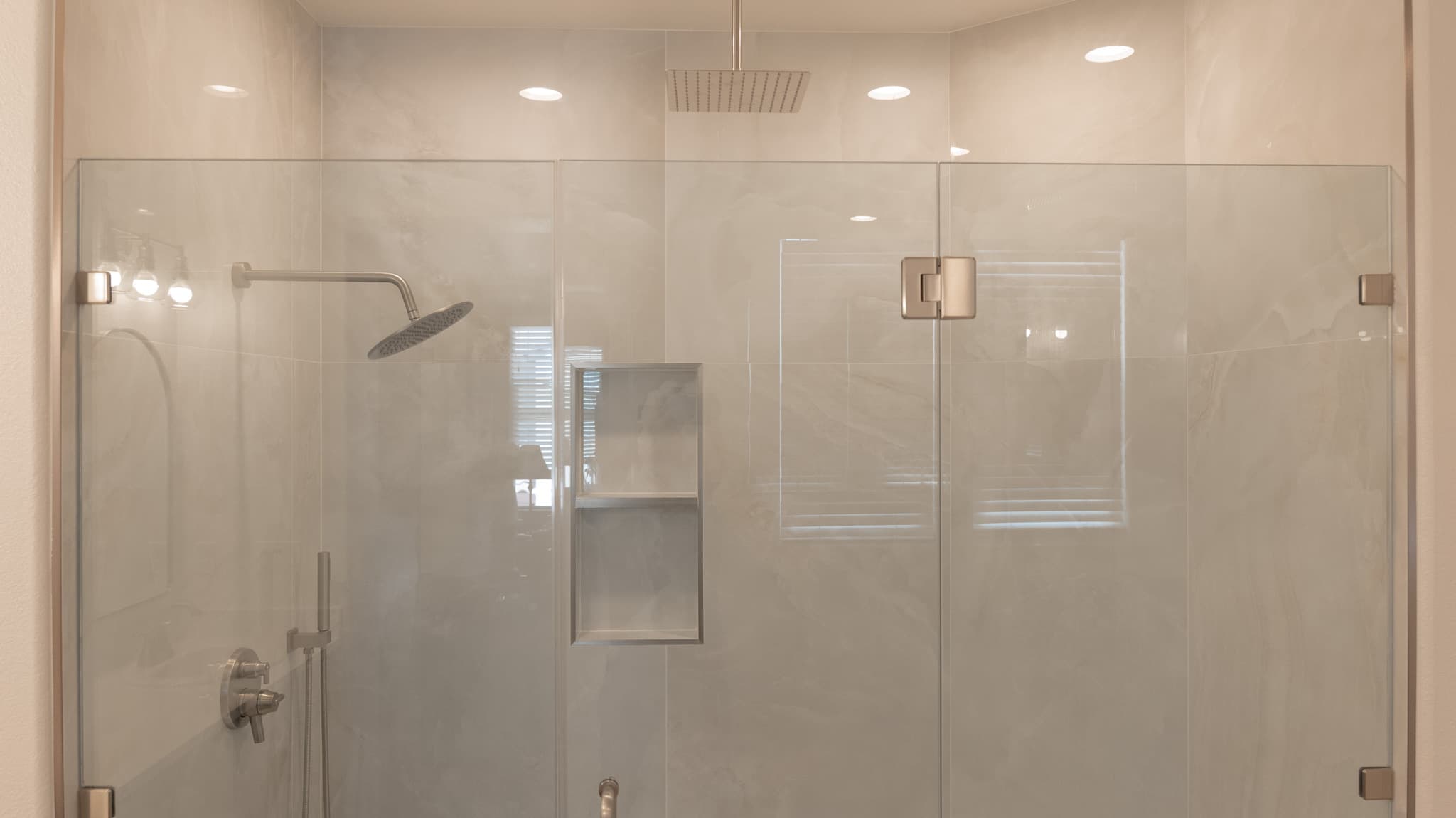 Bathroom Remodel in Sacramento — frameless glass shower, walk-in shower, rain shower head, handheld shower, recessed lighting