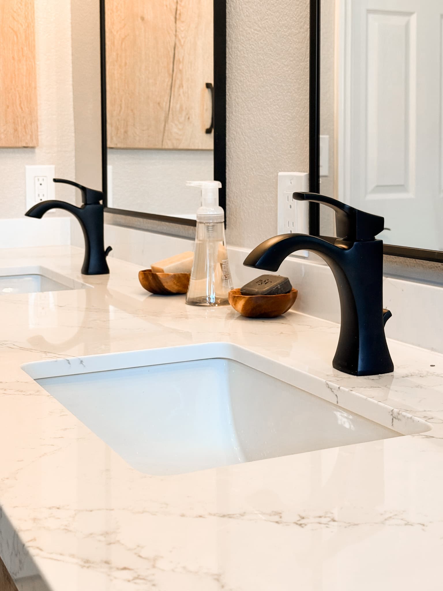 Bathroom Remodel in El Dorado Hills — double vanity, undermount sink, quartz countertop, framed mirror, custom cabinetry
