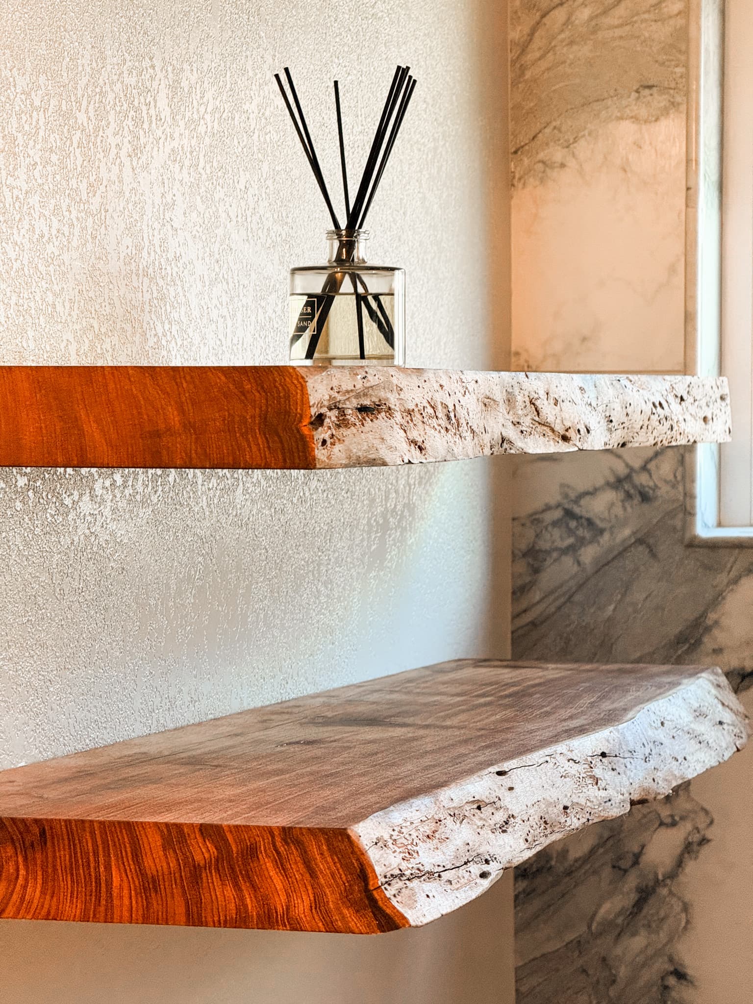 Bathroom Remodel in El Dorado Hills — built-in shelving, natural-stone backsplash, marble tile flooring, butcher-block countertop