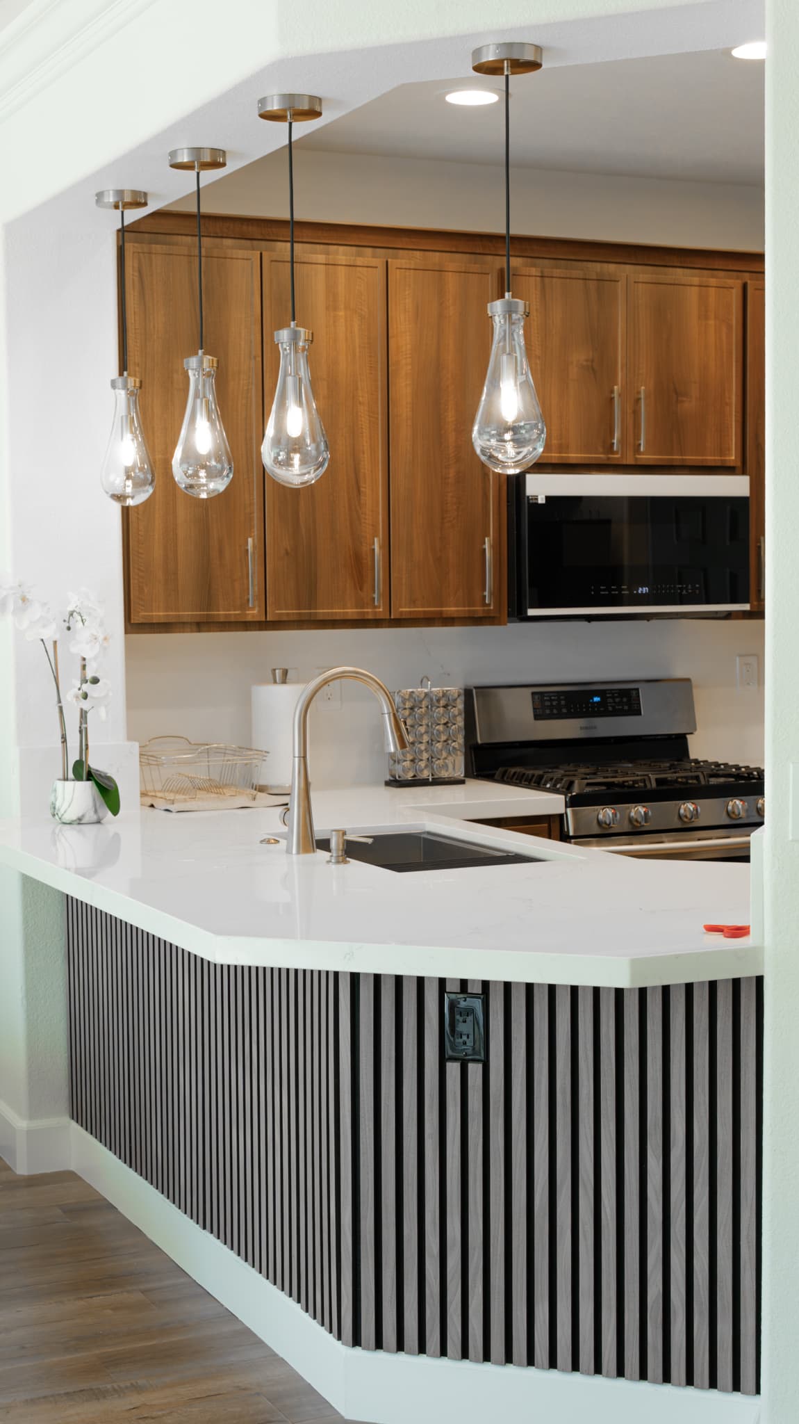 House Renovation in Roseville — pendant lighting, custom cabinetry, quartz countertop, undermount sink, stainless appliances
