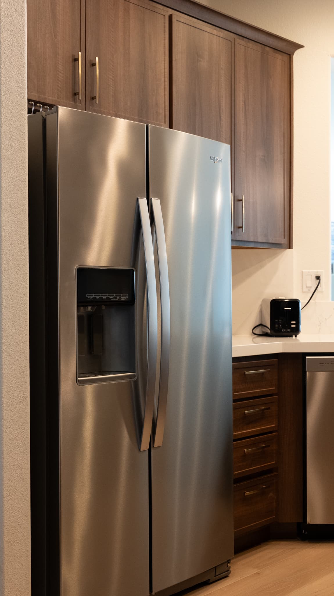 House Renovation in Roseville — raised-panel cabinets, stainless appliances, quartz countertop, luxury vinyl plank, custom cabinetry