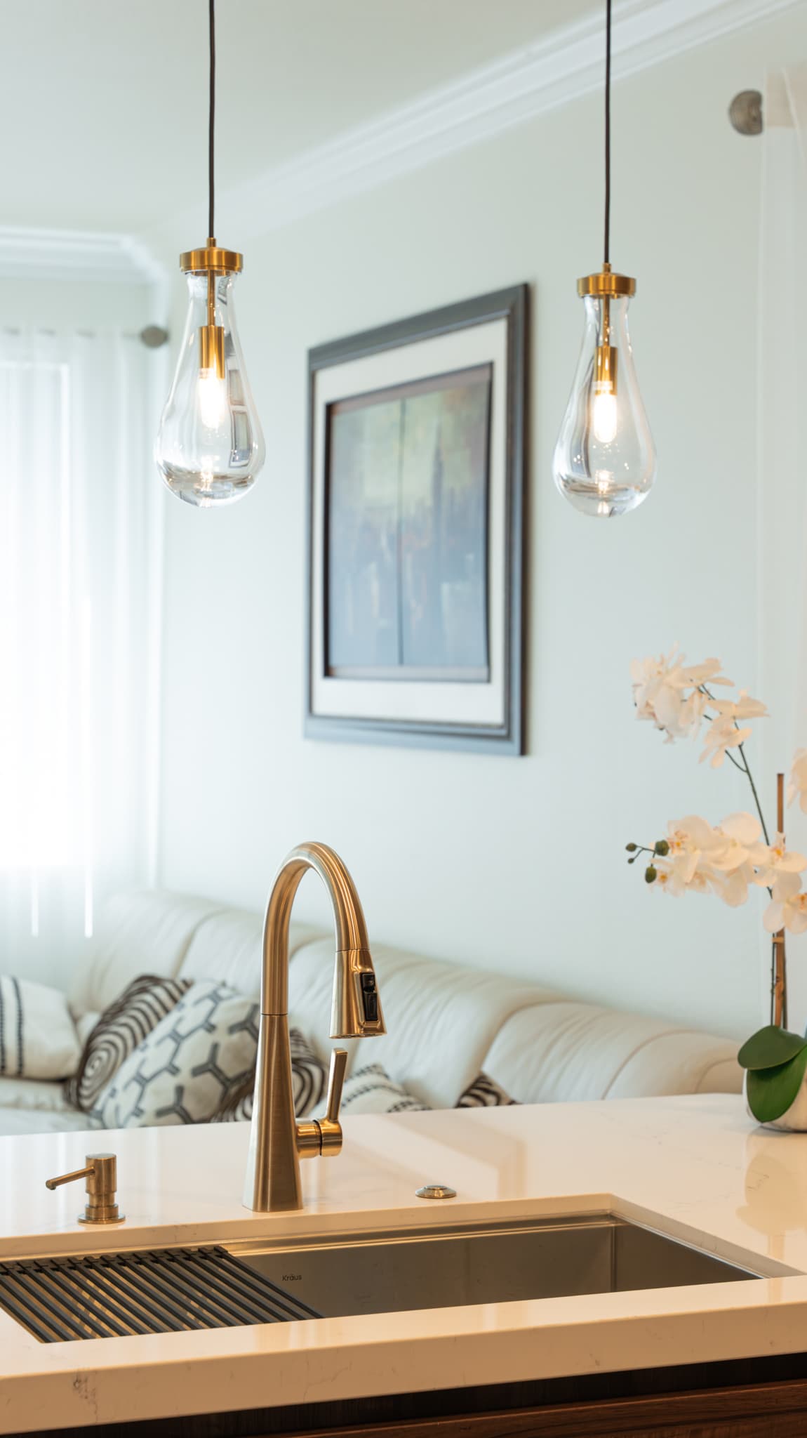 House Renovation in Roseville — pendant lighting, undermount sink, quartz countertop, crown moulding, open-concept layout