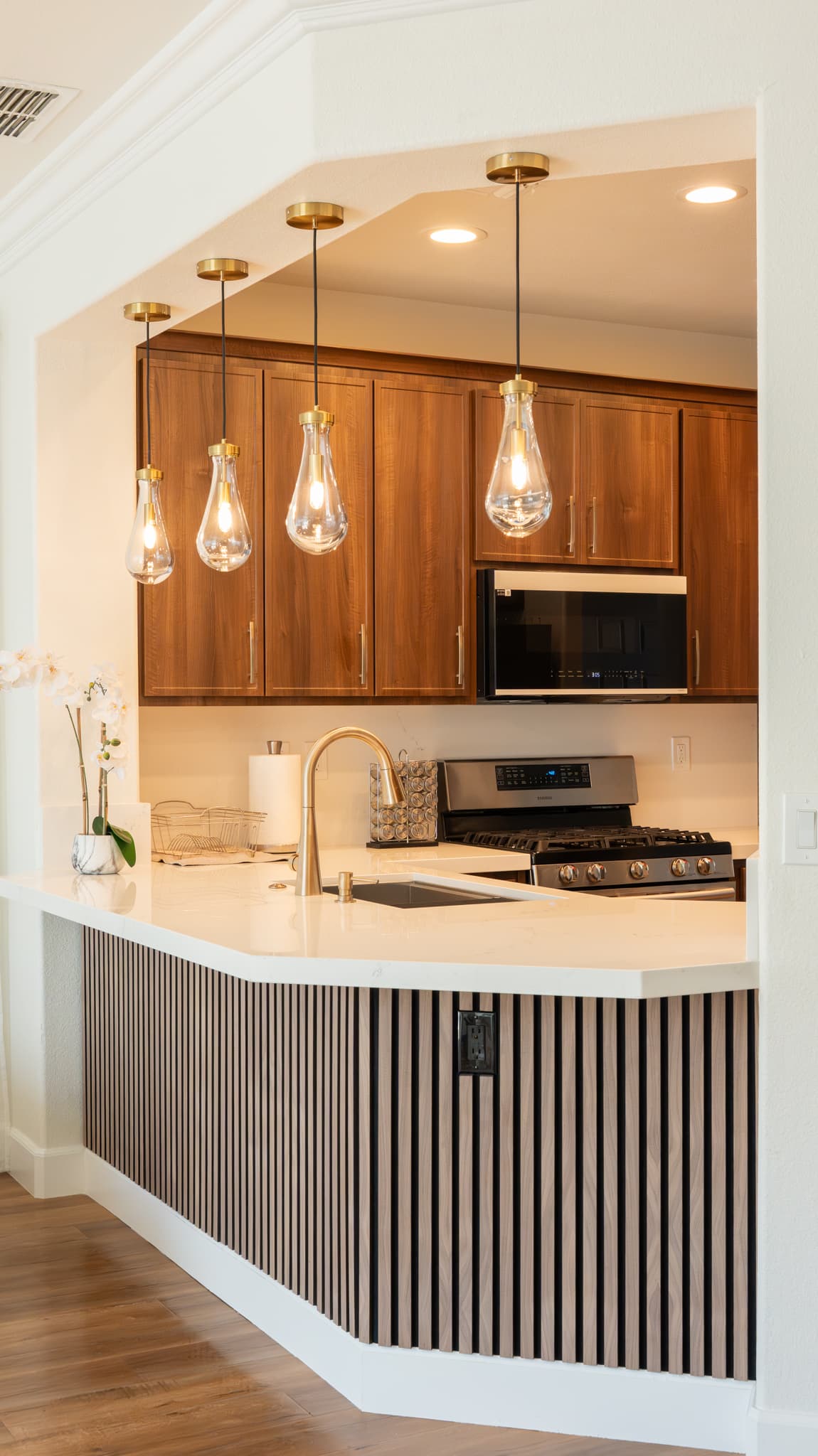 House Renovation in Roseville — pendant lighting, custom cabinetry, quartz countertop, undermount sink, recessed lighting