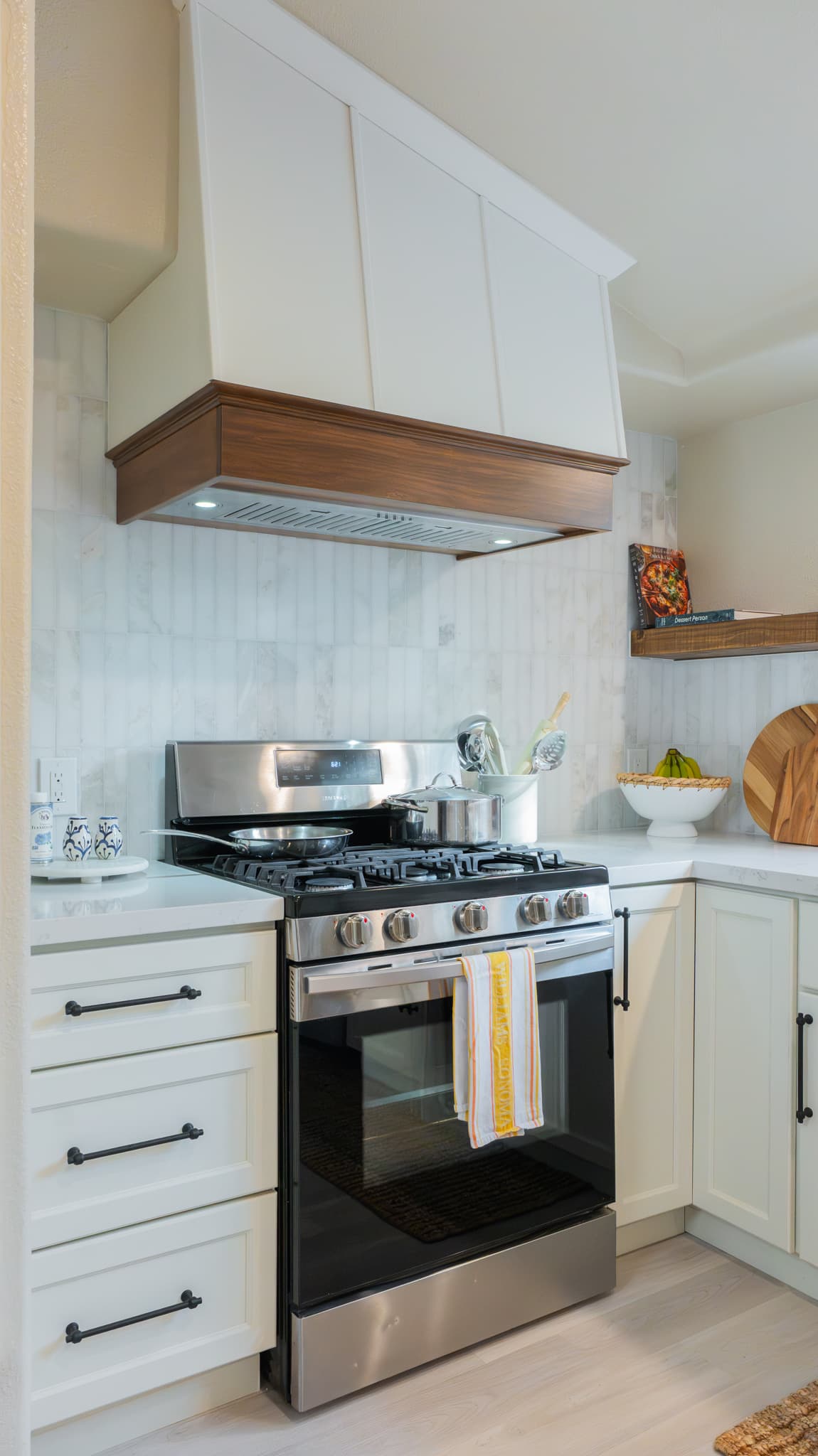Kitchen Remodel in Rocklin — range hood, professional gas range, shaker cabinets, natural-stone backsplash, quartz countertop