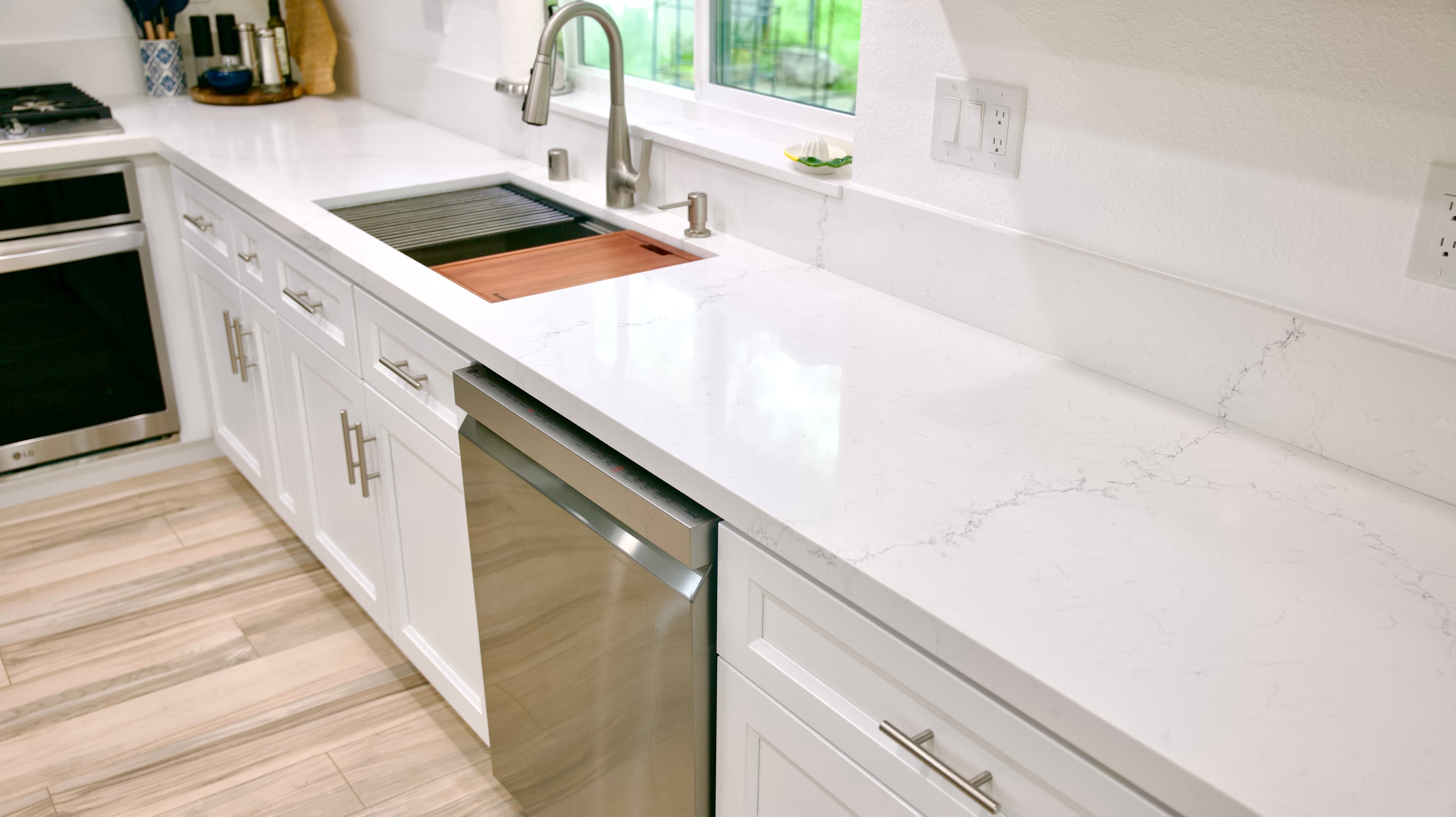 Kitchen Remodel in Sacramento — quartz countertop, shaker cabinets, undermount sink, stainless appliances, porcelain tile flooring
