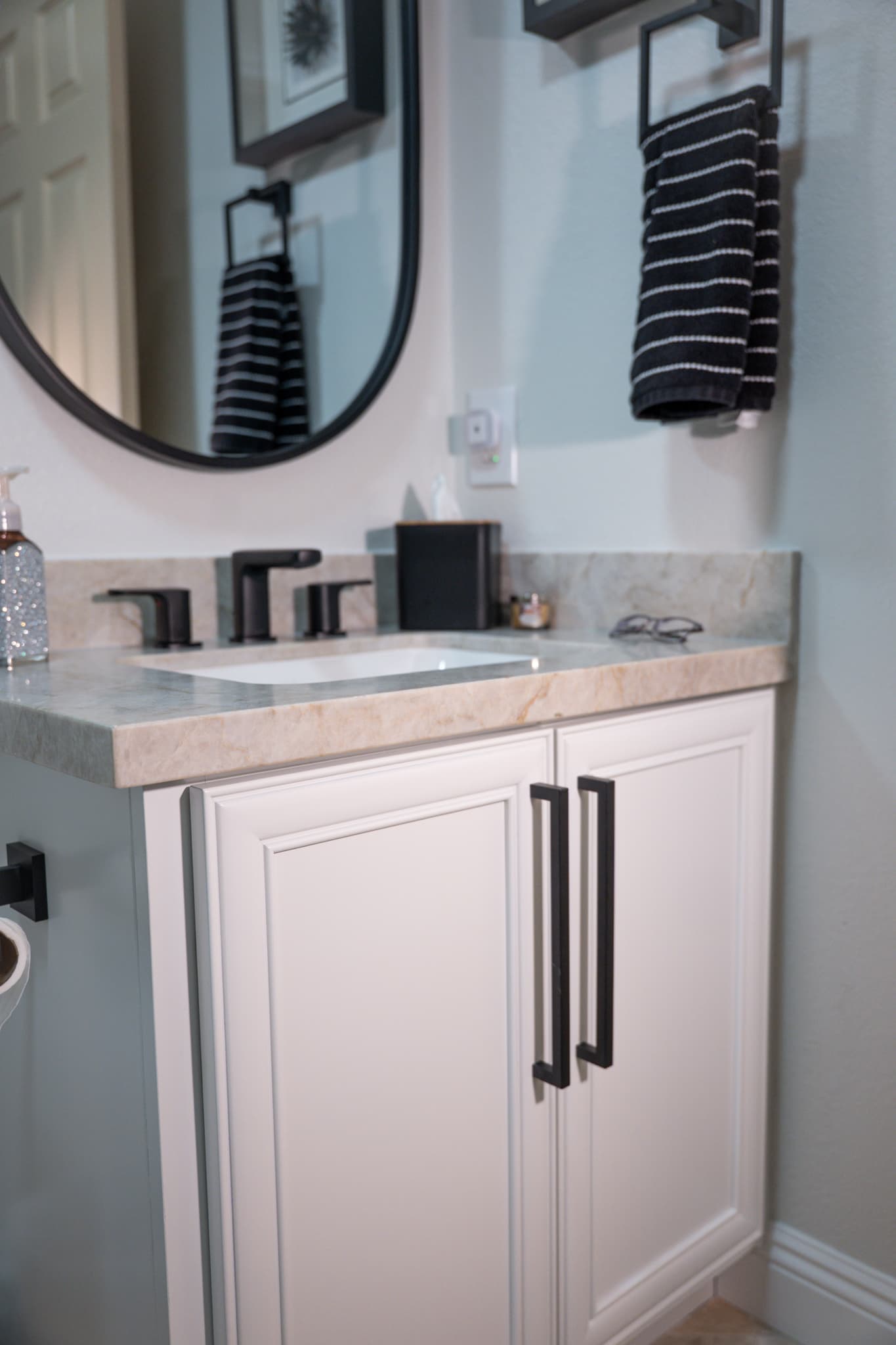 Bathroom Remodel in Folsom — single vanity, undermount sink, marble countertop, raised-panel cabinets, framed mirror