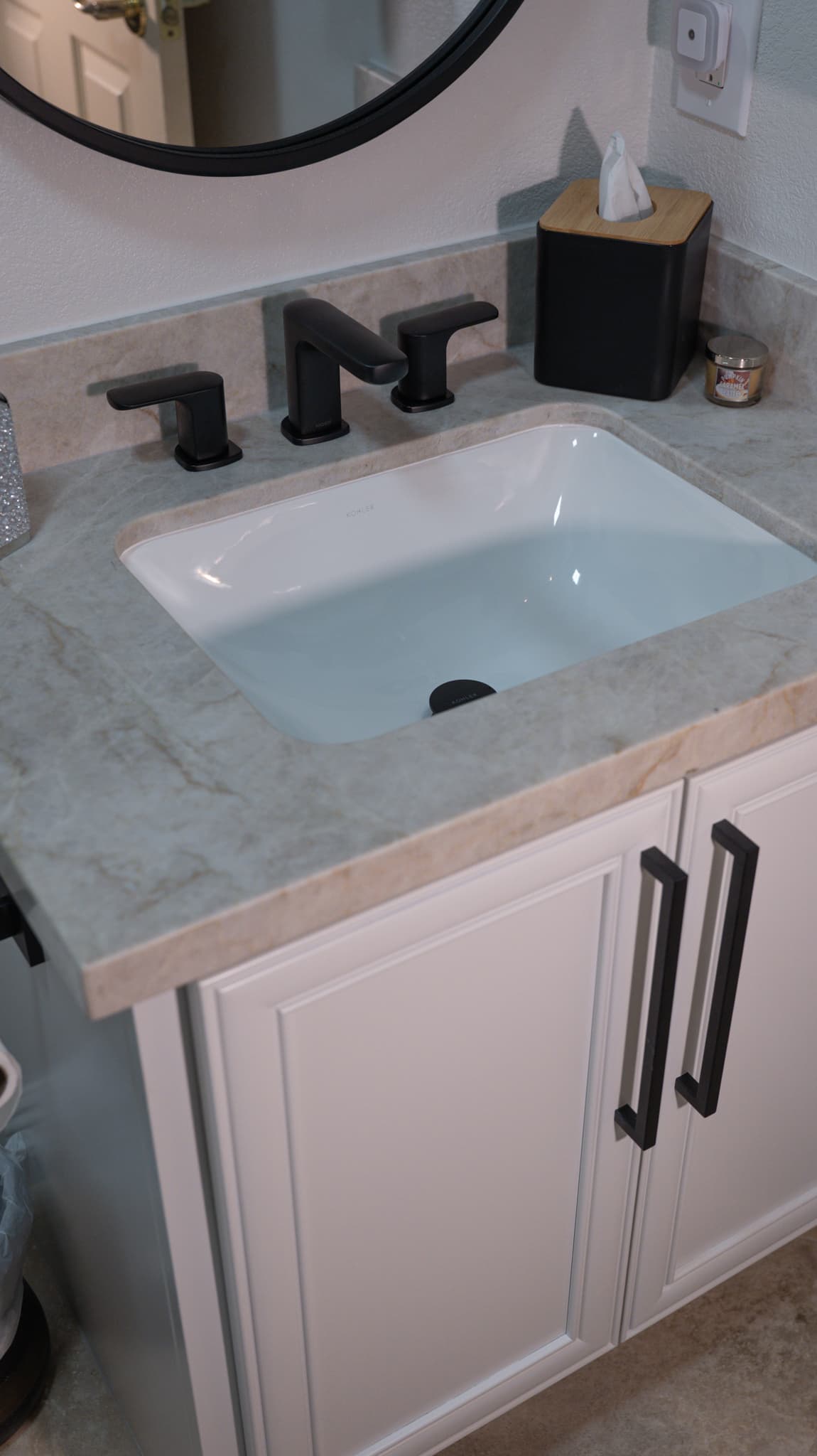 Bathroom Remodel in Folsom — single vanity, undermount sink, marble countertop, raised-panel cabinets, framed mirror