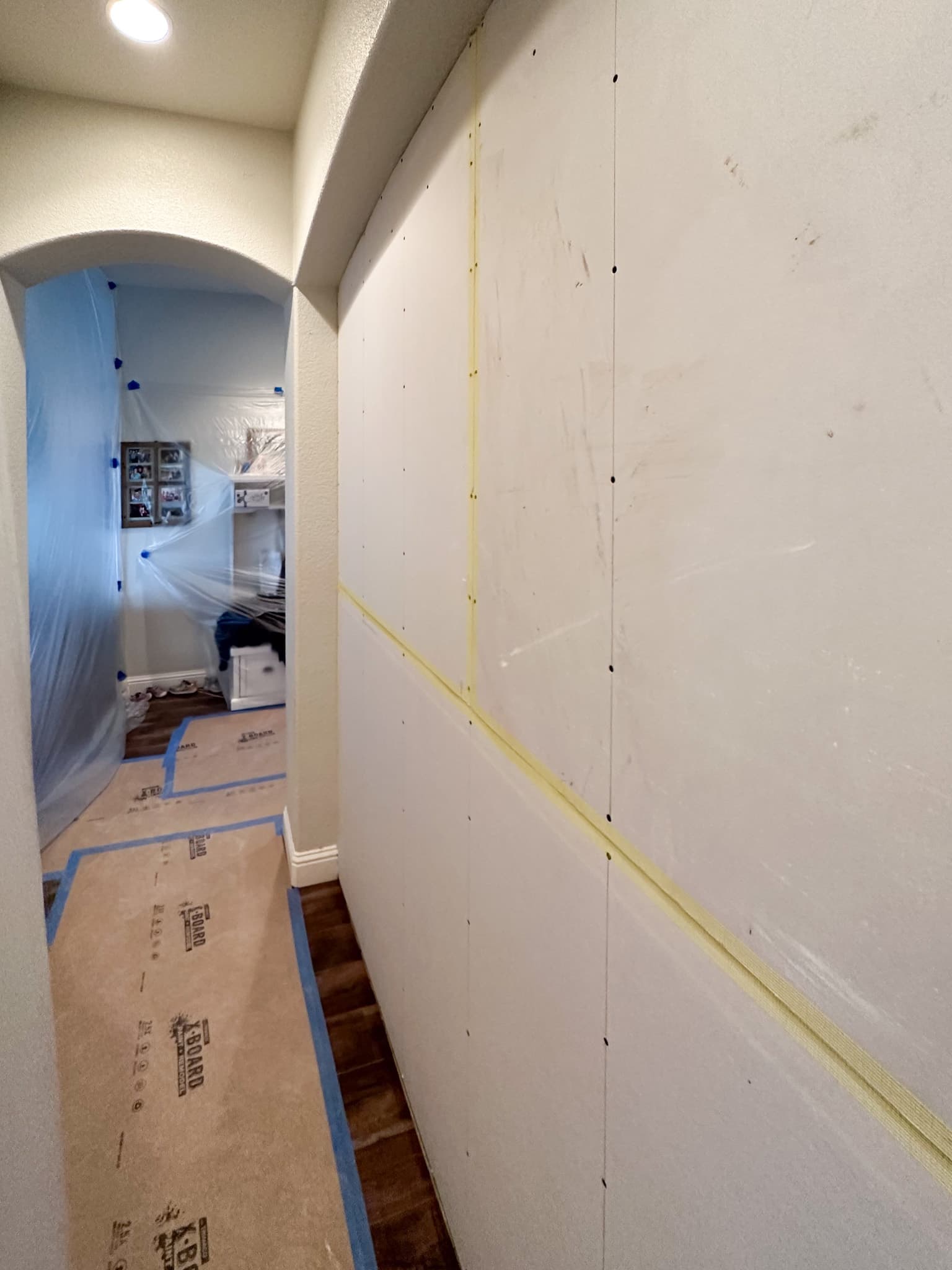House Renovation in Citrus Heights — framing stage, recessed lighting, hardwood flooring, wainscoting
