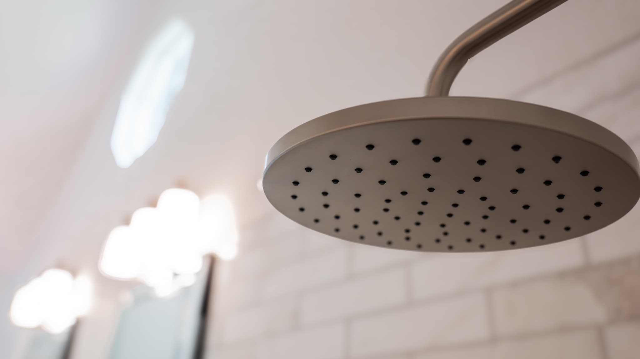 Bathroom Remodel in Sacramento — rain shower head, walk-in shower, tiled shower surround, frameless glass shower