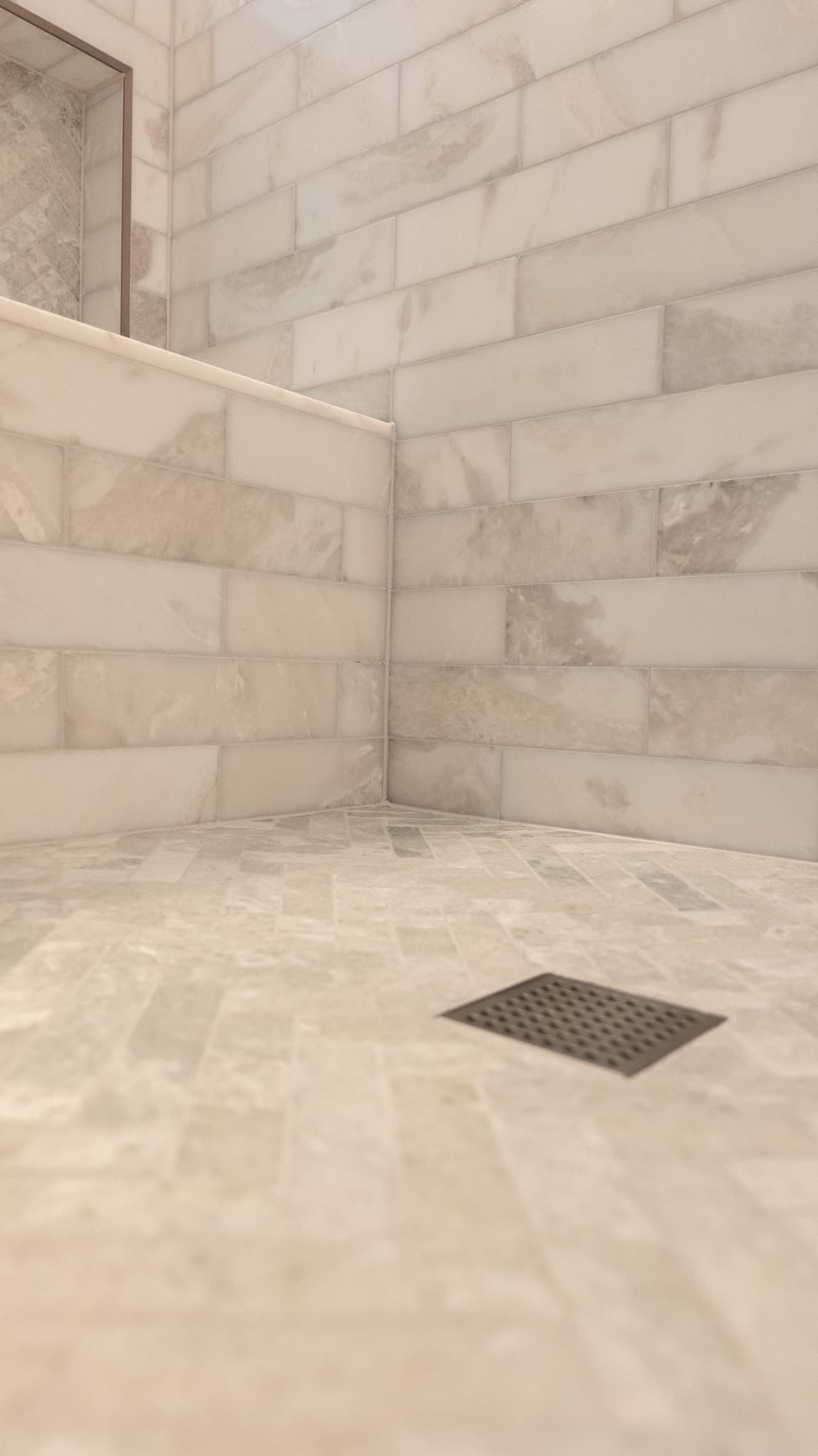 Bathroom Remodel in Sacramento — walk-in shower, tiled shower surround, natural-stone tile flooring, marble tile flooring