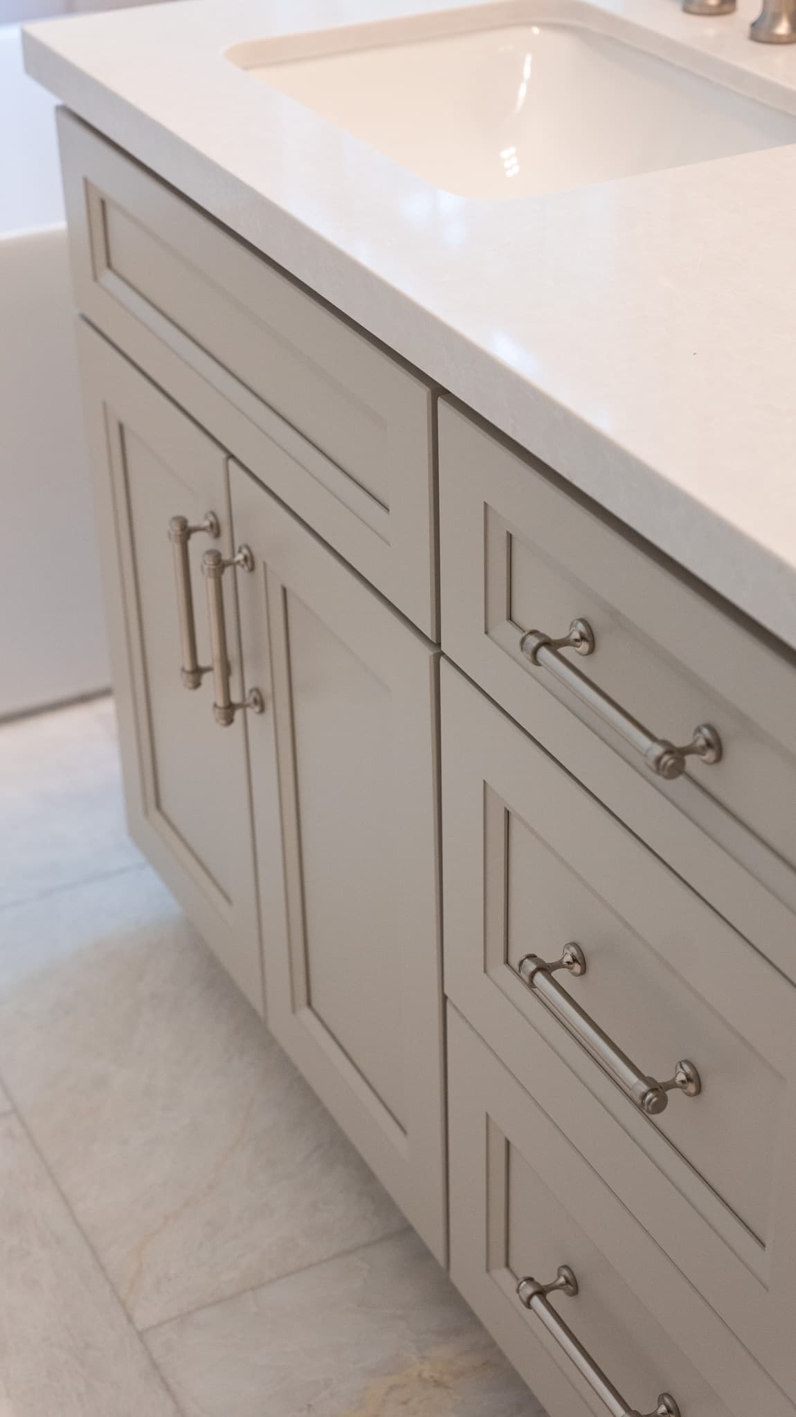 Bathroom Remodel in Sacramento — raised-panel cabinets, quartz countertop, undermount sink, double vanity, porcelain tile flooring