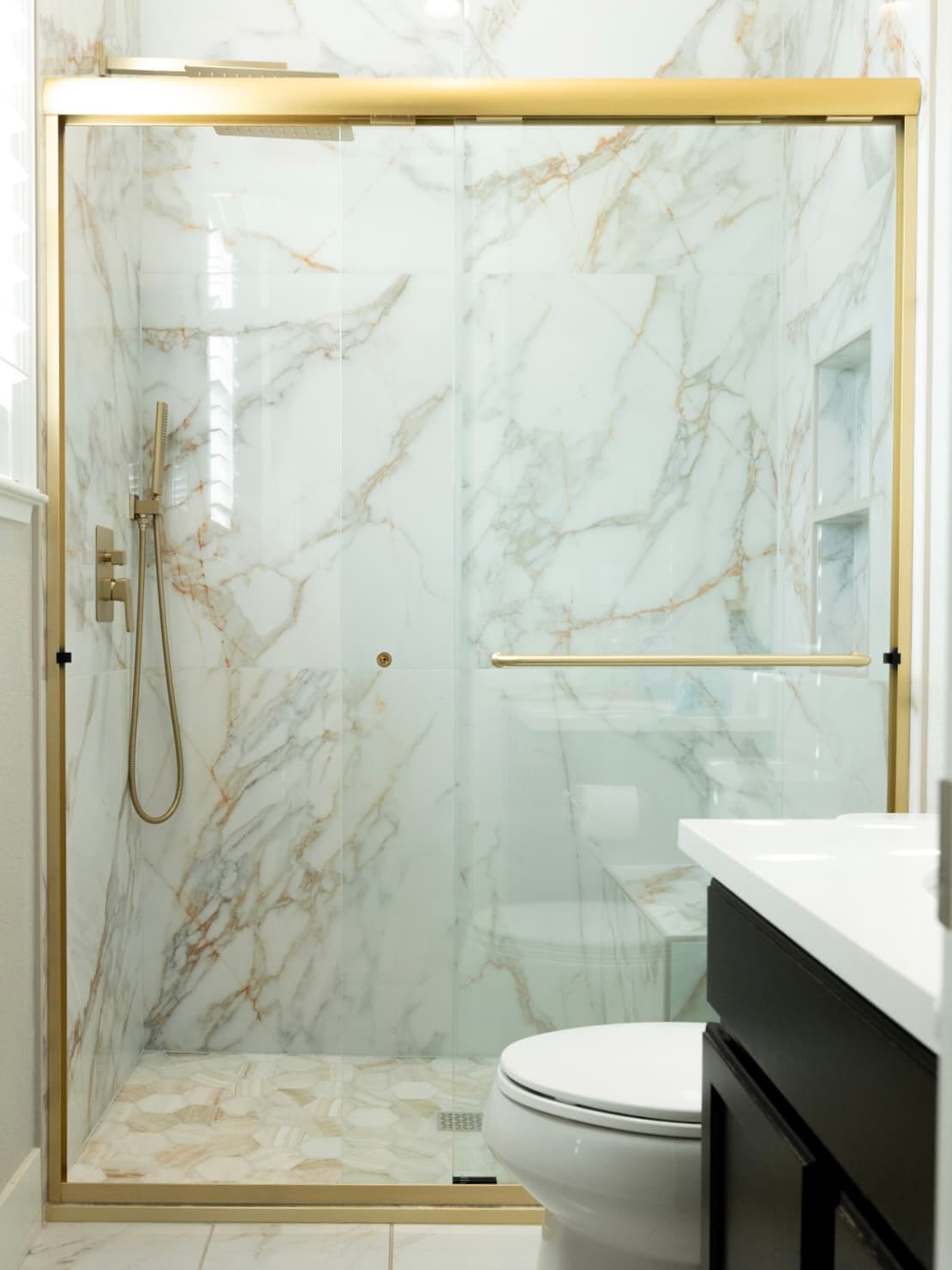 Bathroom Remodel in El Dorado Hills — walk-in shower, frameless glass shower, tiled shower surround, handheld shower, shower bench