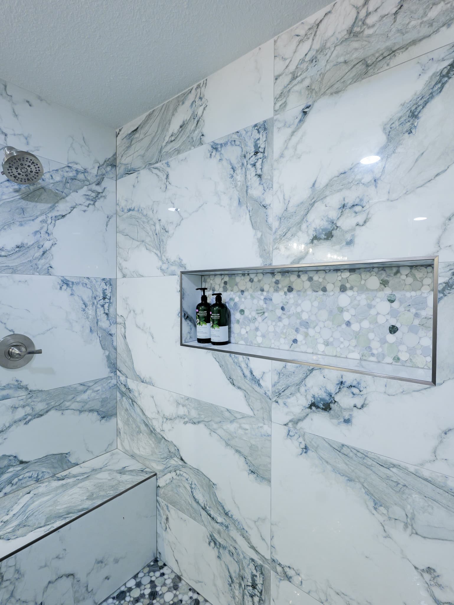 Bathroom Remodel in Sacramento — tiled shower surround, walk-in shower, shower bench, mosaic backsplash, recessed lighting