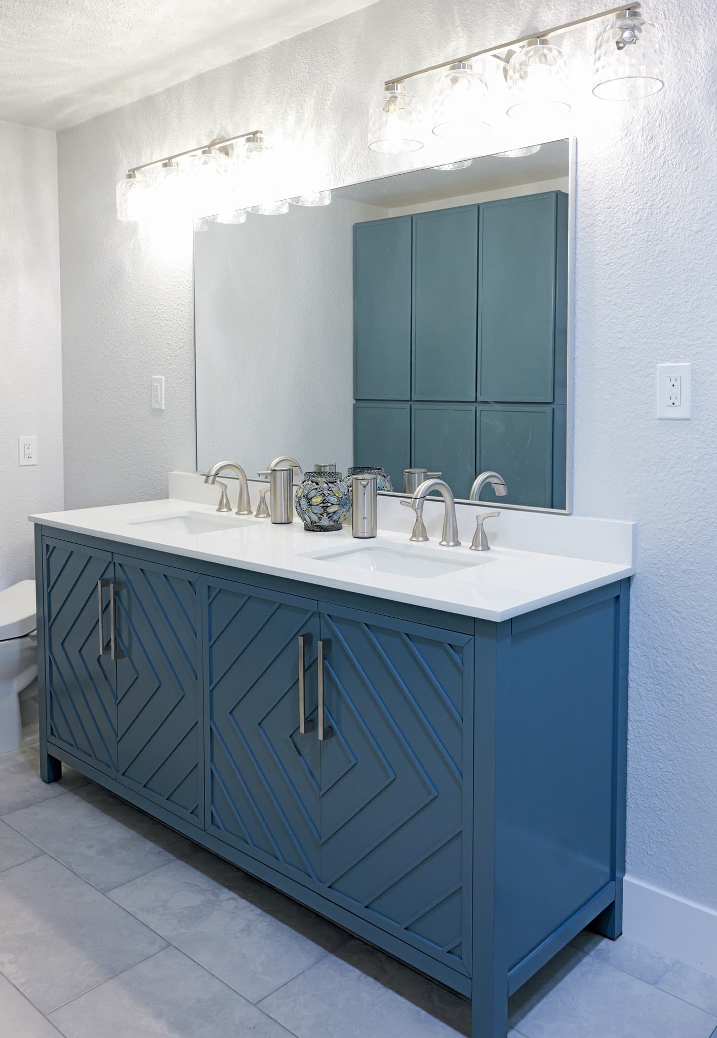 Bathroom Remodel in Sacramento — double vanity, custom cabinetry, quartz countertop, undermount sink, porcelain tile flooring