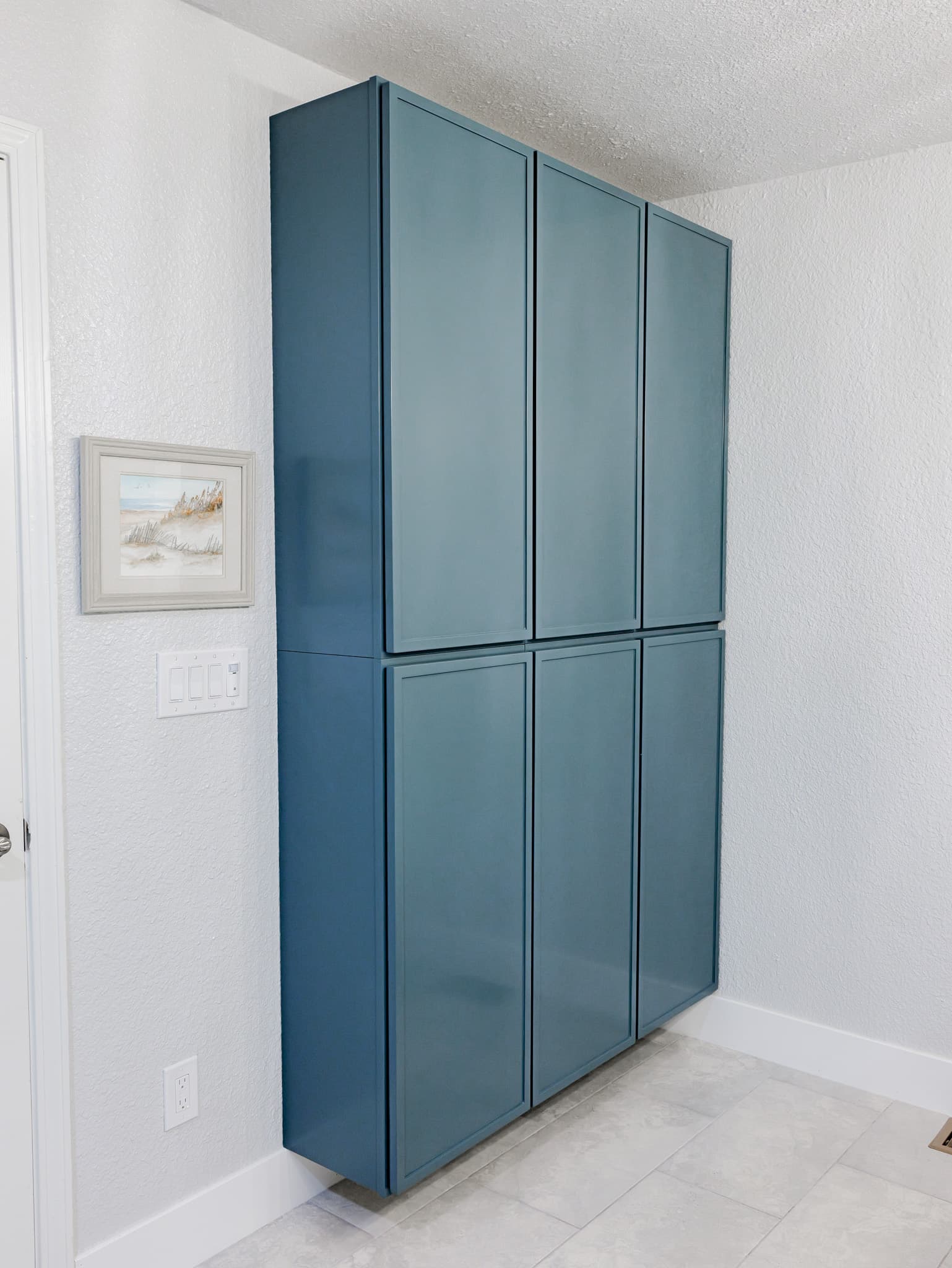 Bathroom Remodel in Sacramento — custom cabinetry, linen tower, porcelain tile flooring, built-in shelving