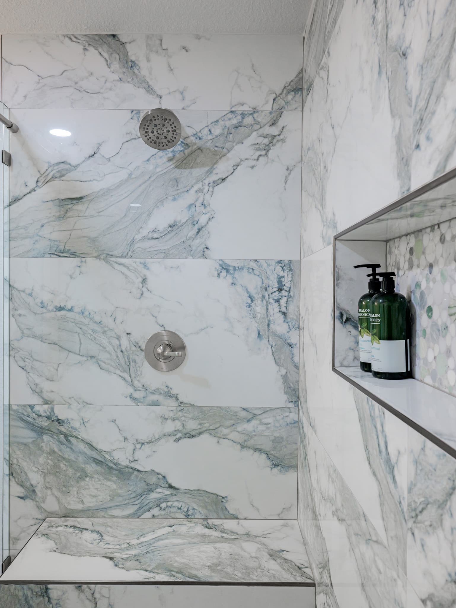 Bathroom Remodel in Sacramento — walk-in shower, frameless glass shower, marble tile flooring, rain shower head, mosaic backsplash