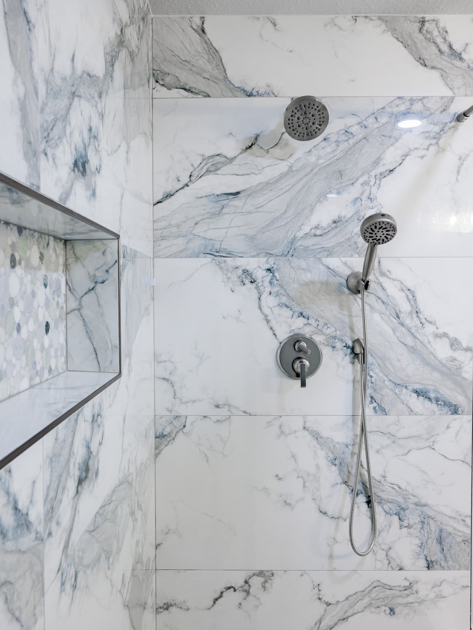 Bathroom Remodel in Sacramento — walk-in shower, marble tile flooring, tiled shower surround, rain shower head, handheld shower
