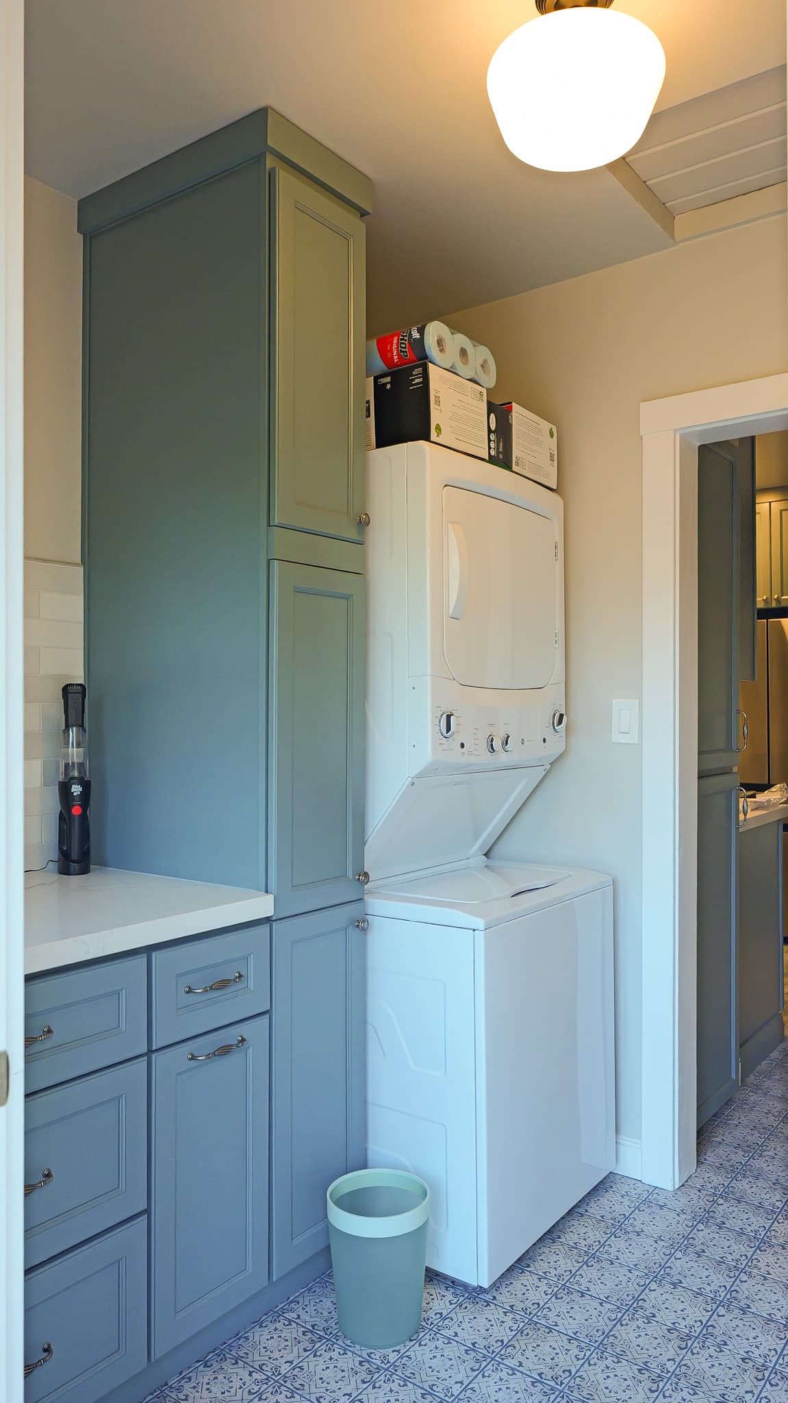 Kitchen Remodel in Sacramento — raised-panel cabinets, linen tower, two-tone cabinetry, quartz countertop, ceramic tile flooring