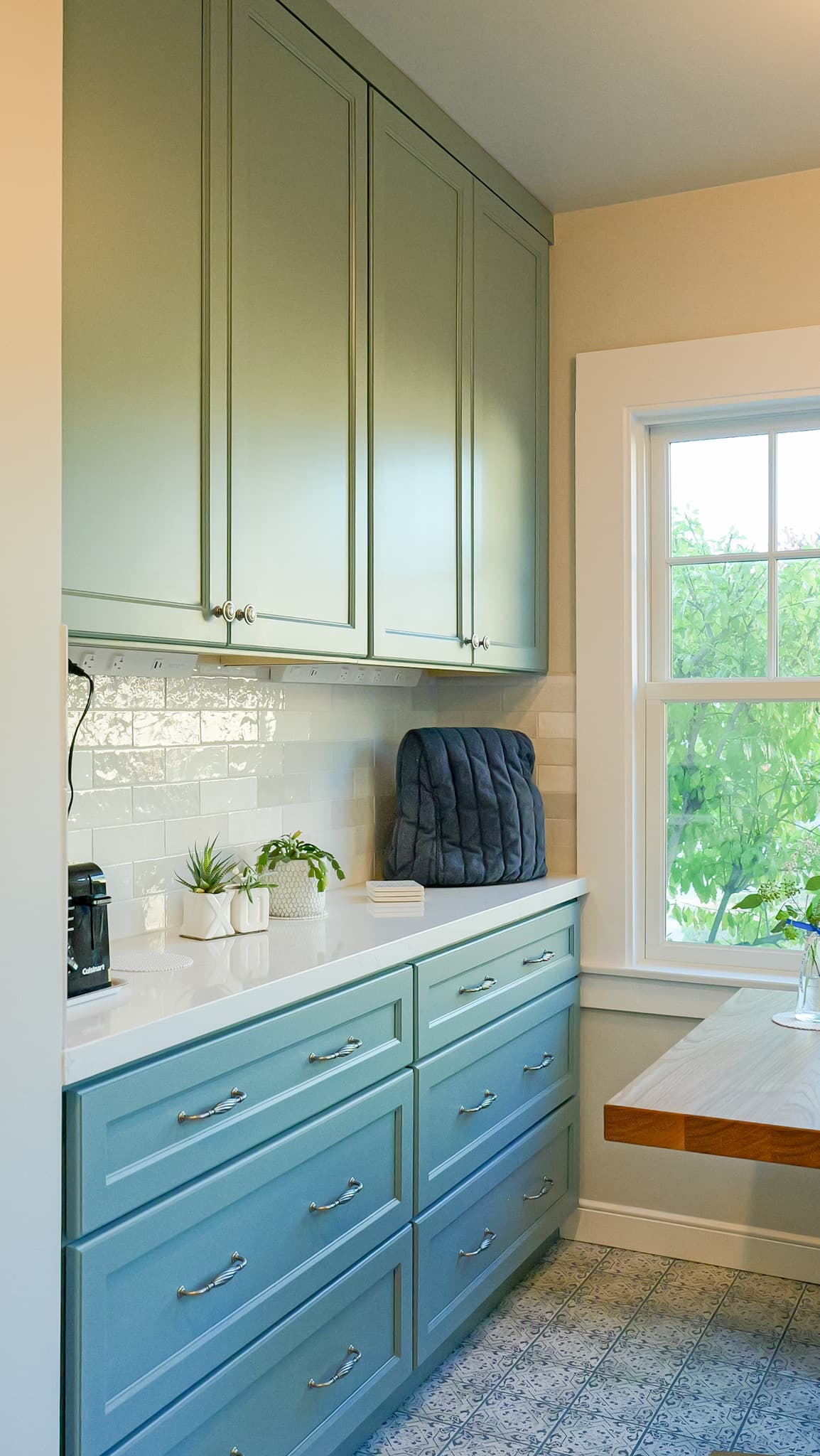 Kitchen Remodel in Sacramento — two-tone cabinetry, raised-panel cabinets, subway tile backsplash, quartz countertop, ceramic tile flooring